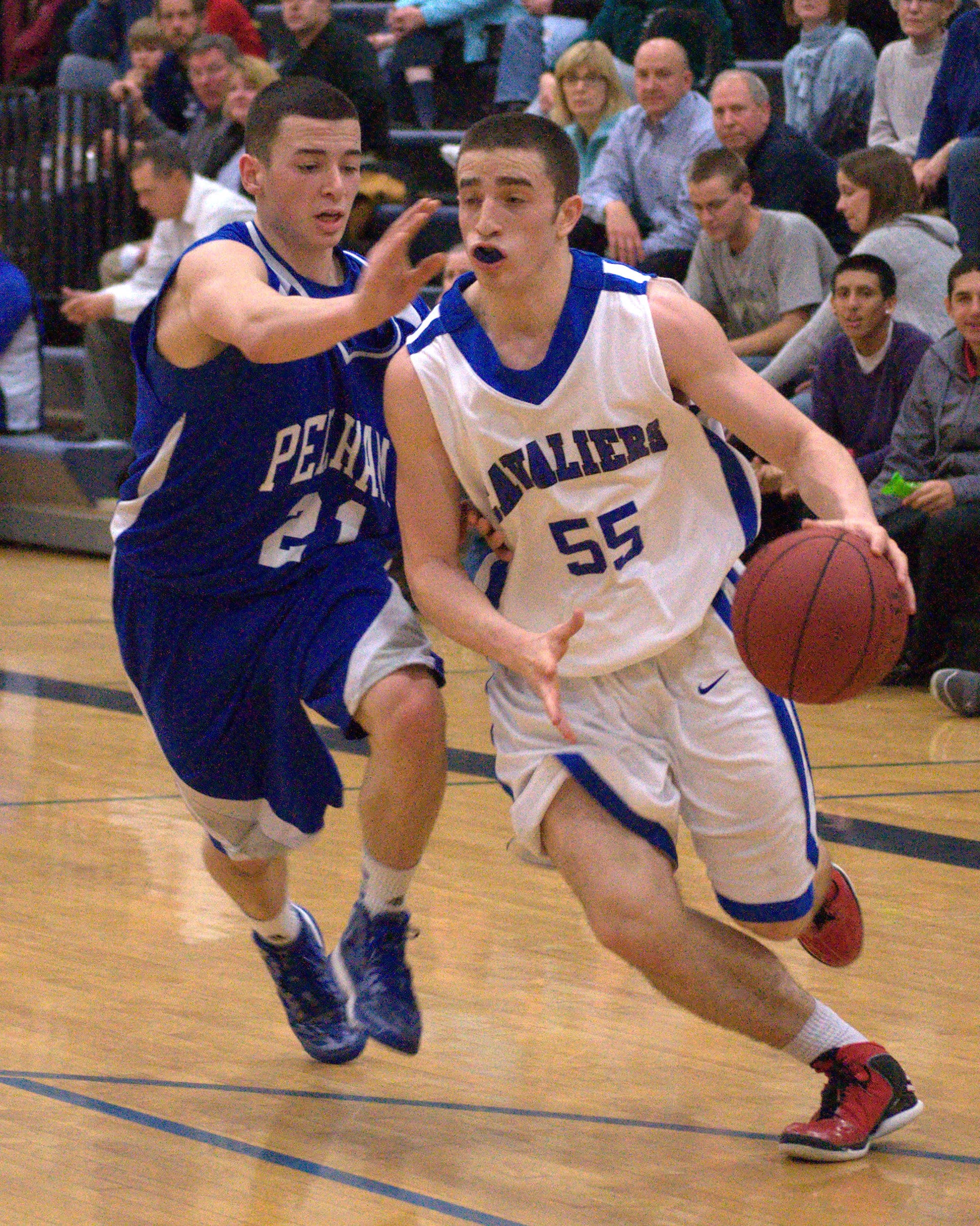 Hollis Brookline's PJ Flaum drives to the basket.