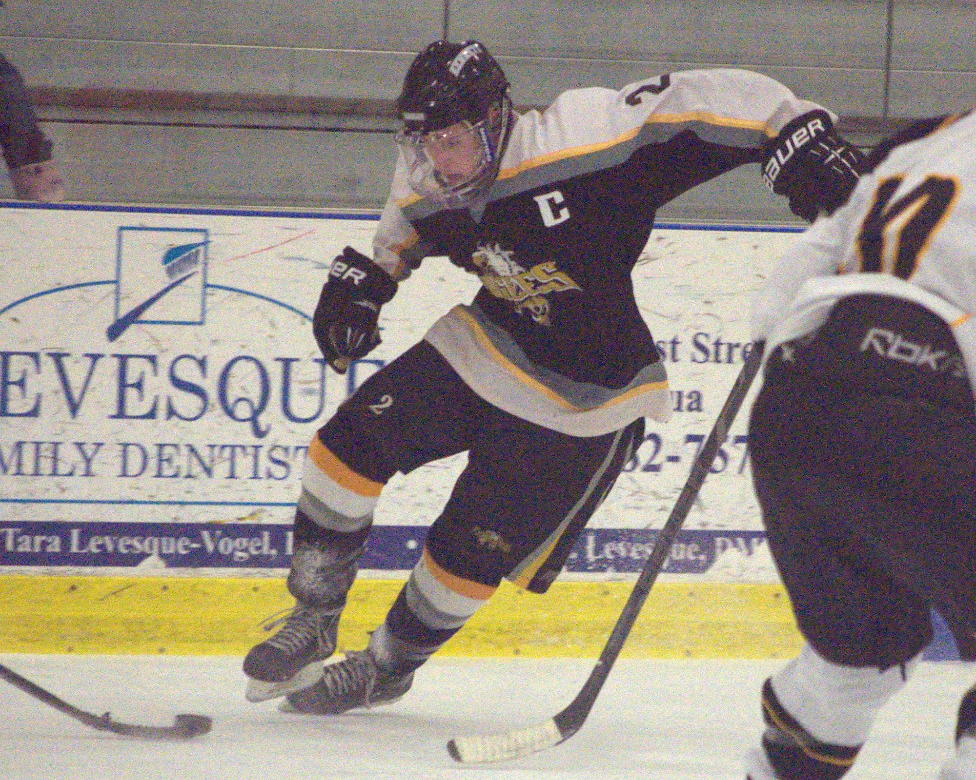 Kennett's Connor Todd tries to move through the Souhegan defense.