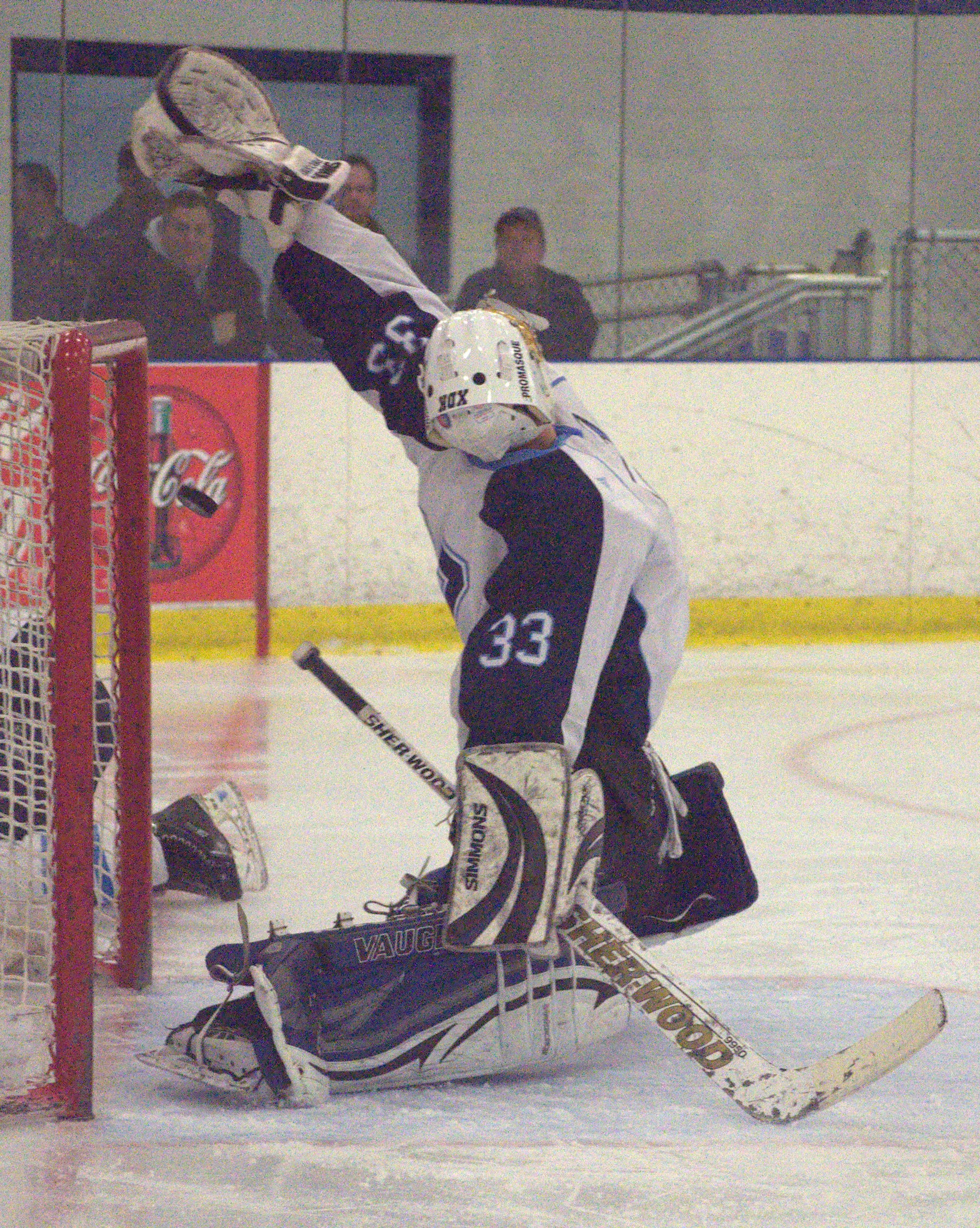 Nashua North's Jake Genest tries to make a save.