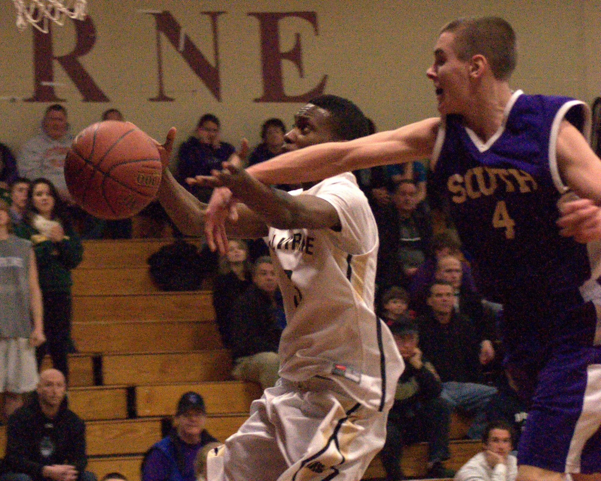 Nashua South's Tim Preston knocks the ball away from Alvirne's Kevin Pierre.
