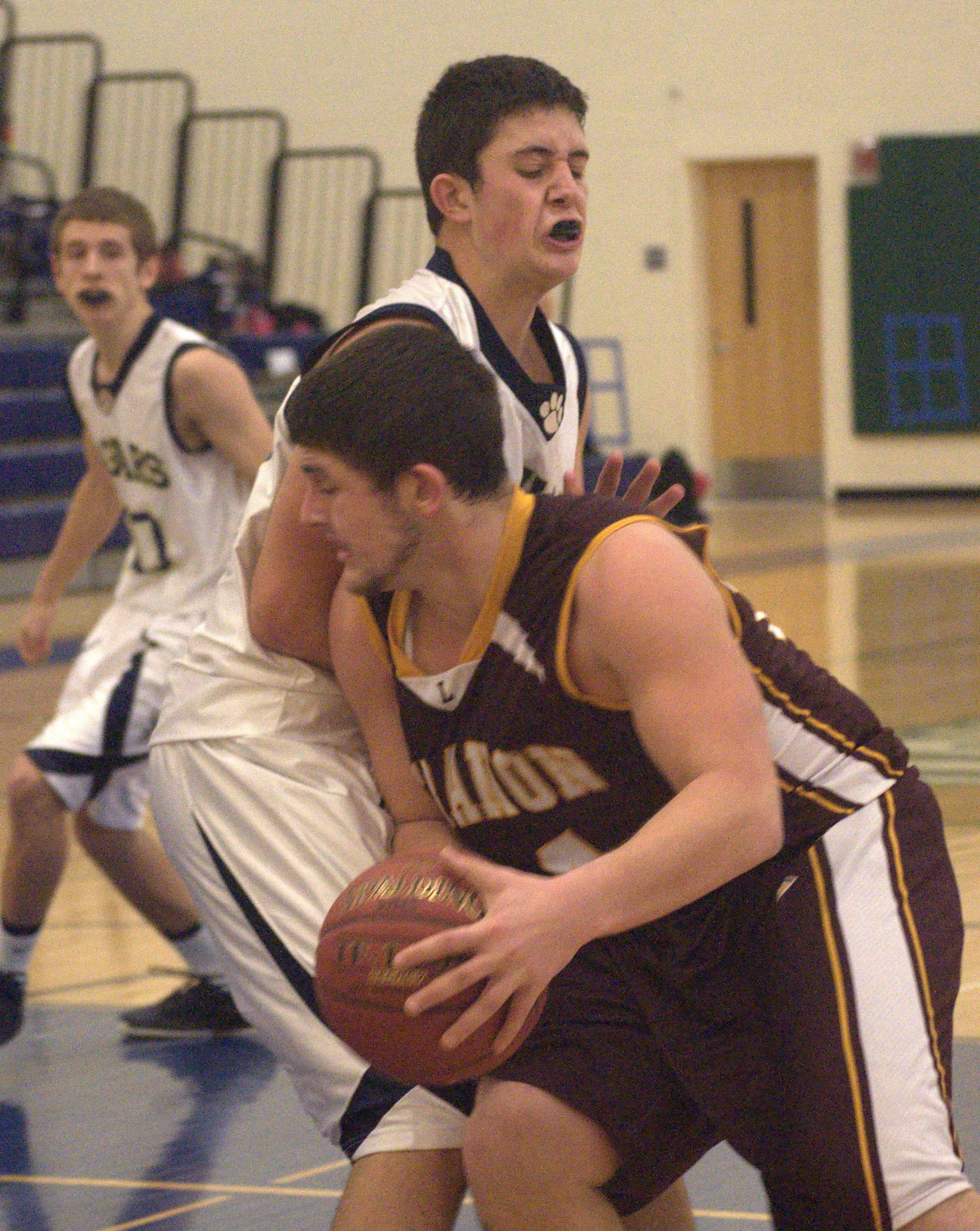 Windham's Conor Redmond tries to draw a charge against Lebanon's Dylan Drew.