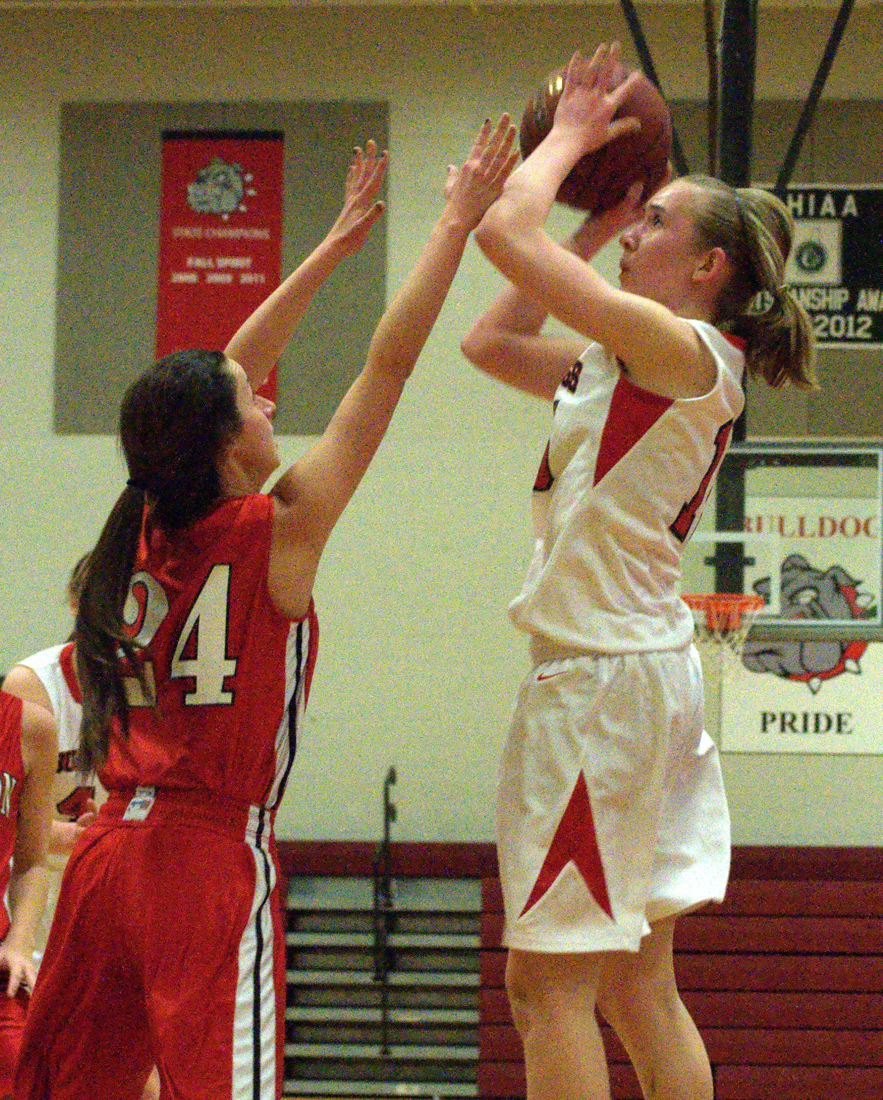 Bedford's Rachel Collins pulls up for a shot over Pinkerton's Brandi Bonneau during Friday's game. For more photos, go to the Photo Album.