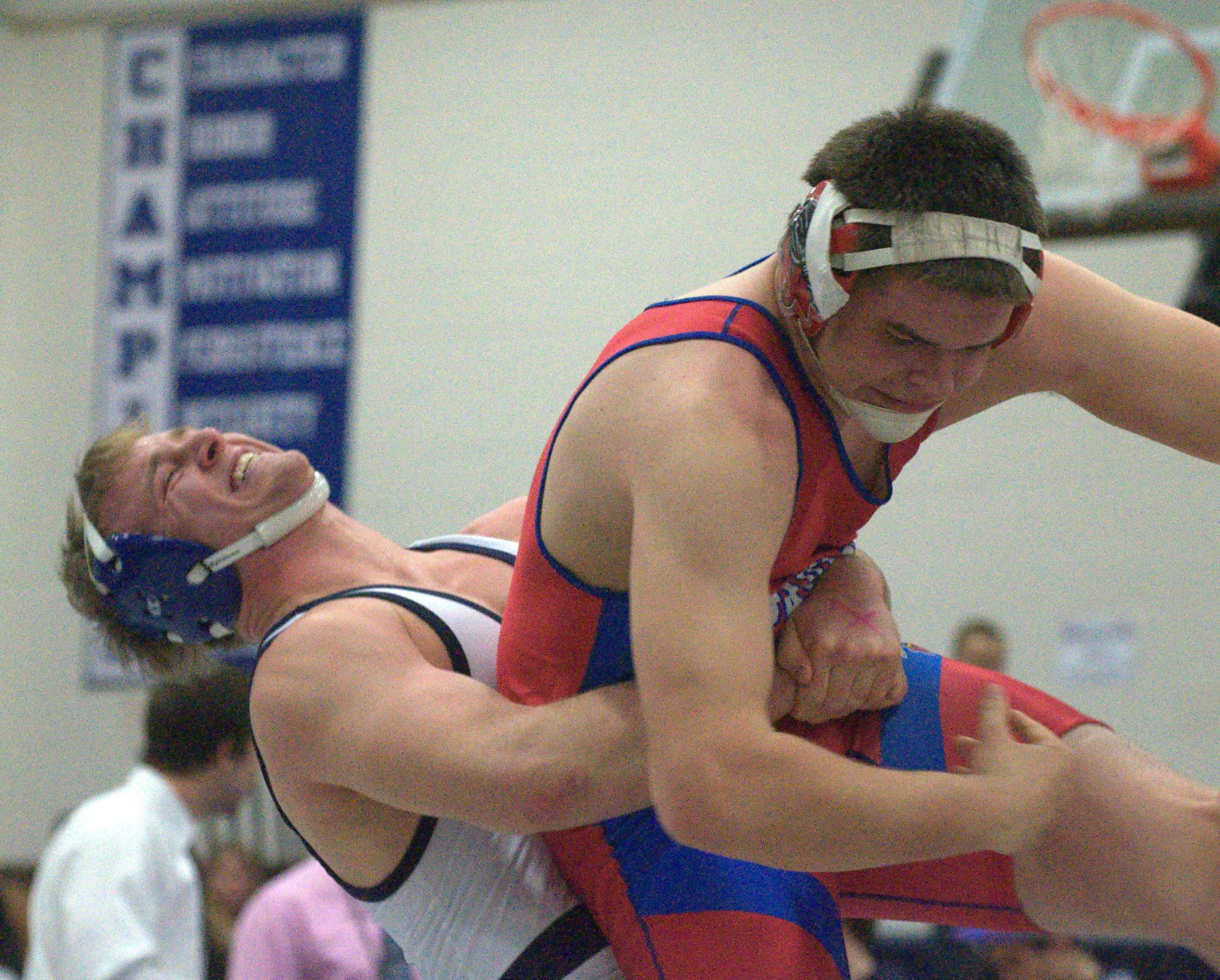 Hollis Brookline's Nate Ashe tries to pick up Spaulding's Evan Drouin during the 195-pound final Saturday at the Division II meet. Ashe won the match and Hollis Brookline won the title.