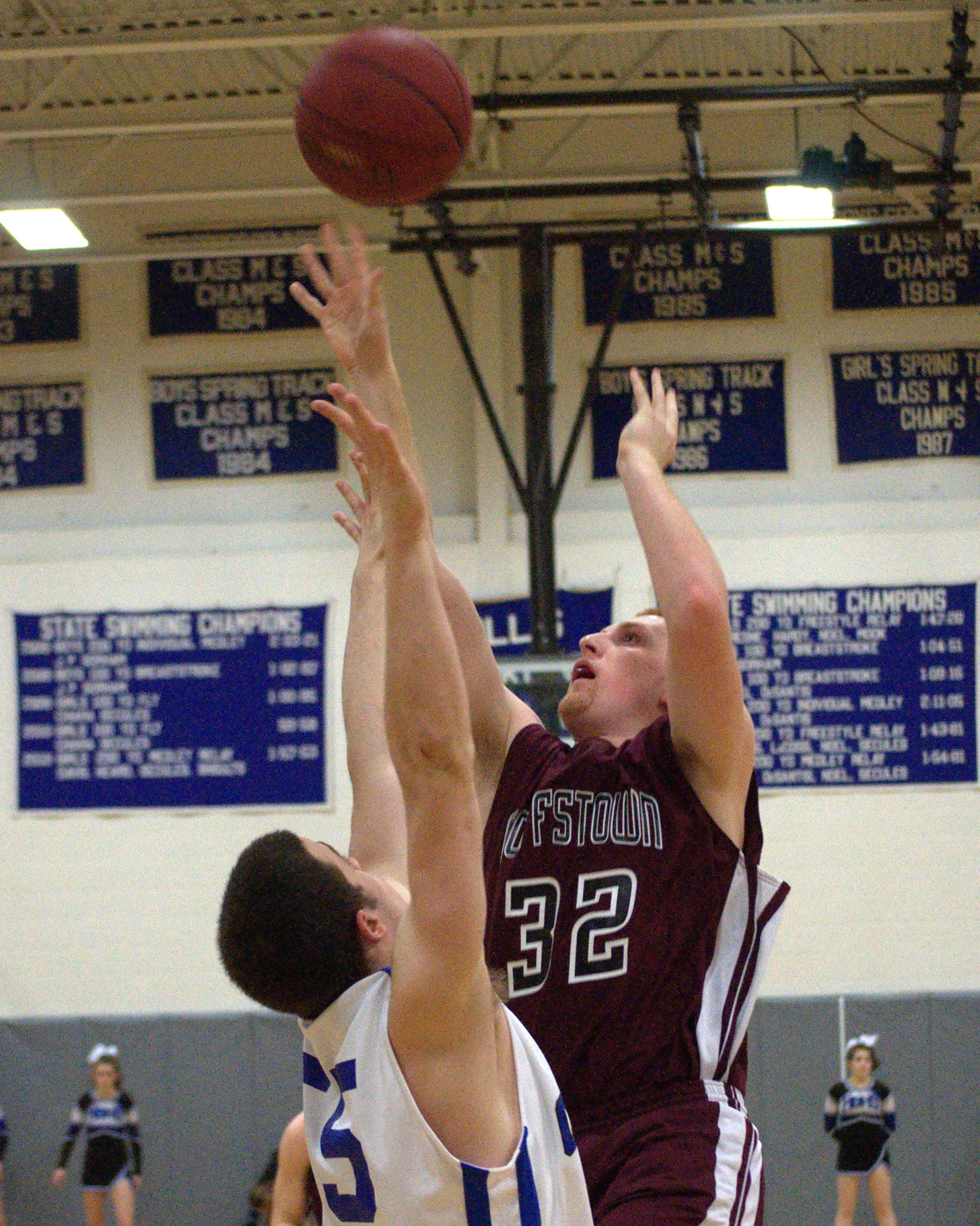 Goffstown's Patrick Kelsey shoots over Hollis Brookline's PJ Flaum.