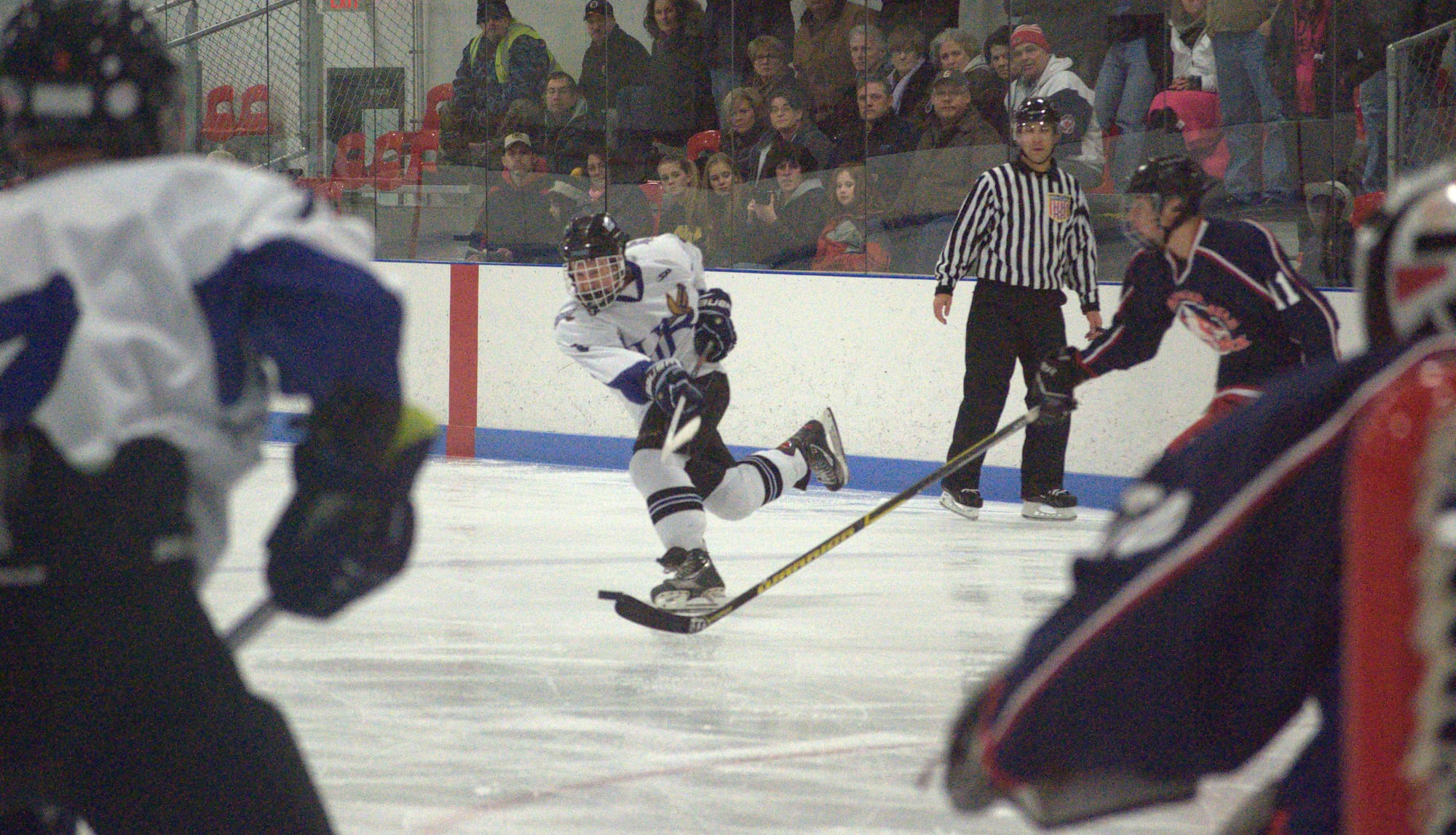 Hollis Brookline's Matt Mailloux fires a shot during Monday's game against Laconia-Winnisquam.