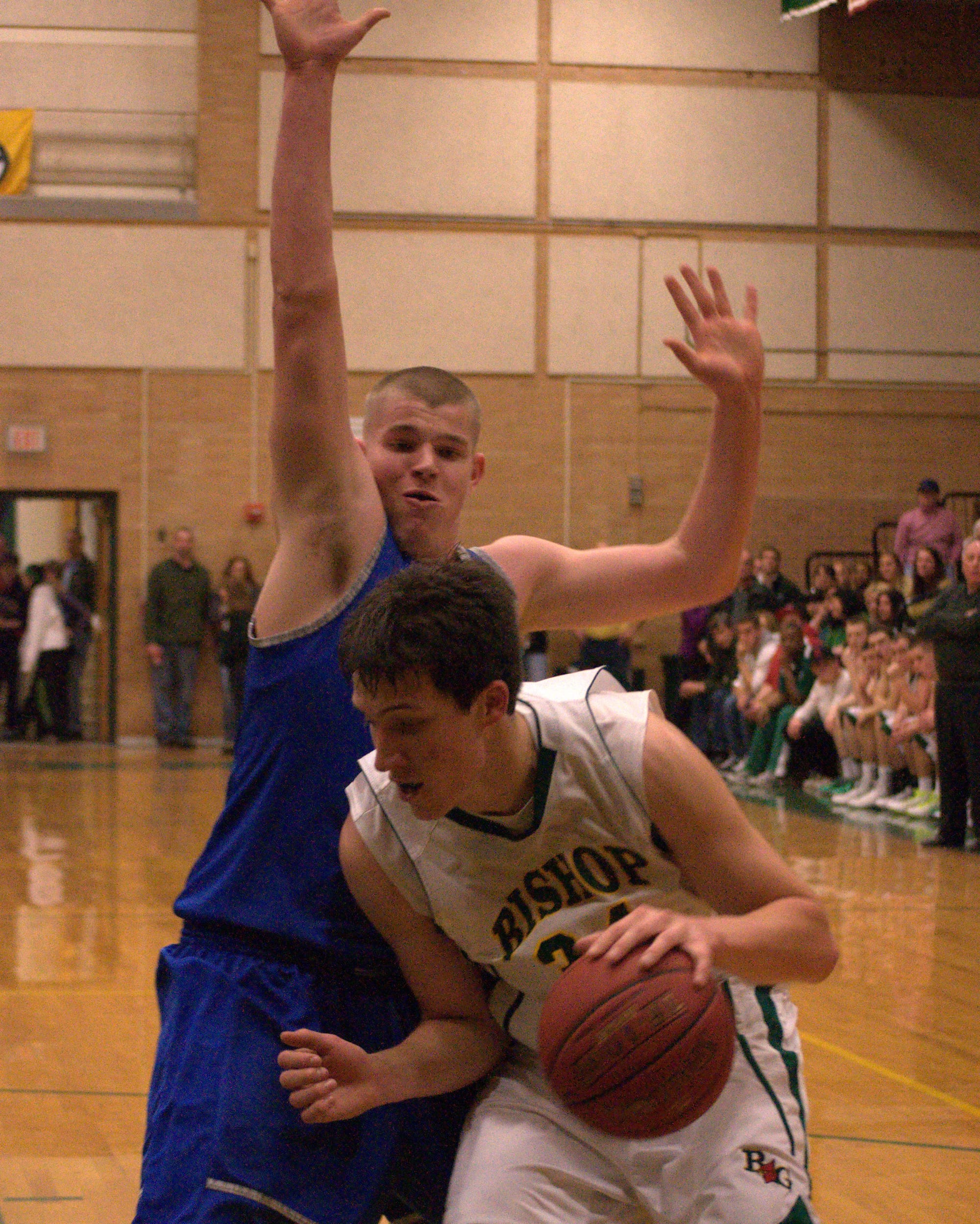 Merrimack's Brad Jarry tries to defend against Bishop Guertin's Jeff Lunn. For more photos, go to the Photo Album.