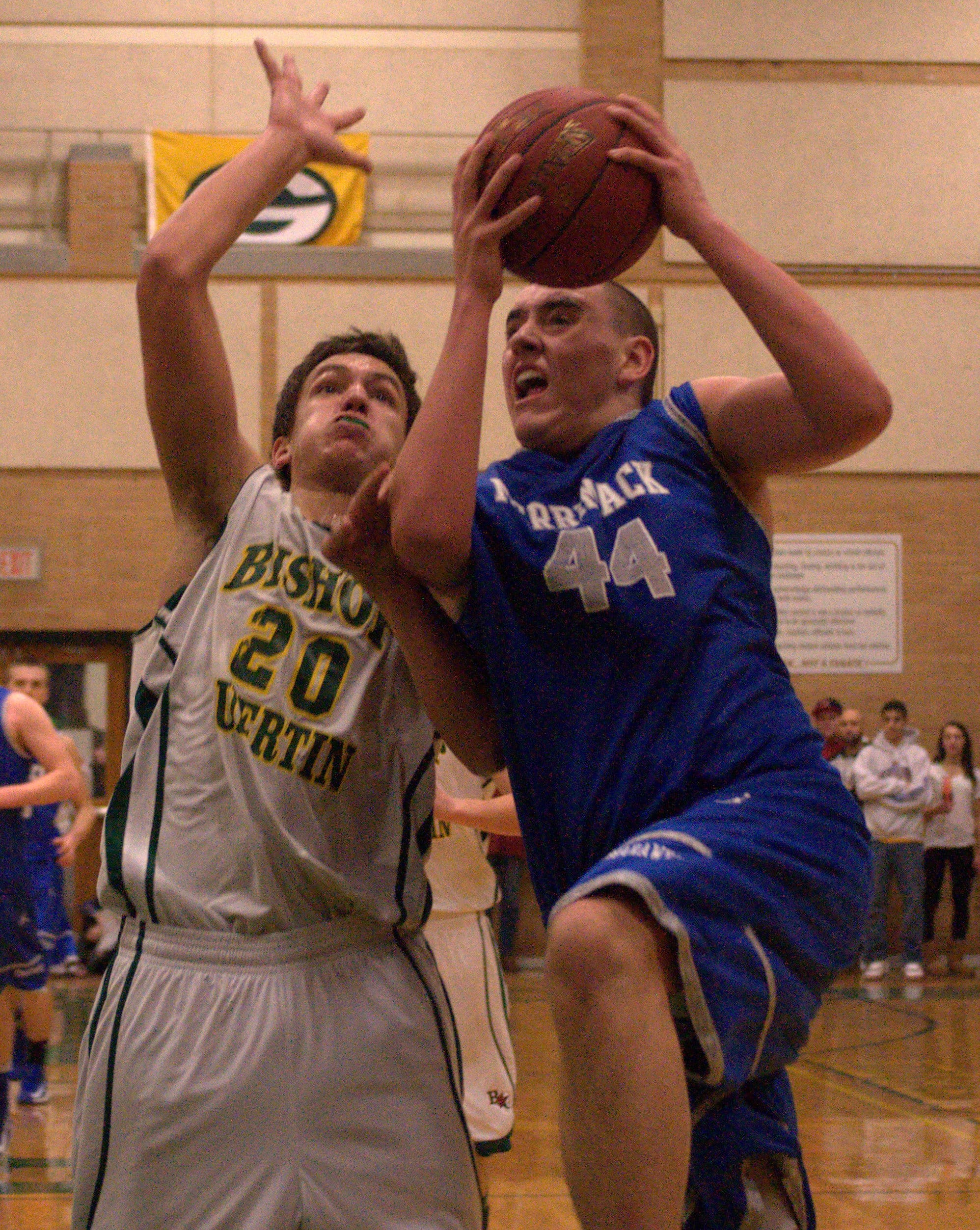 Merrimack's Shayne Bourque drives to the basket against Bishop Guertin's Costas Niarhos.