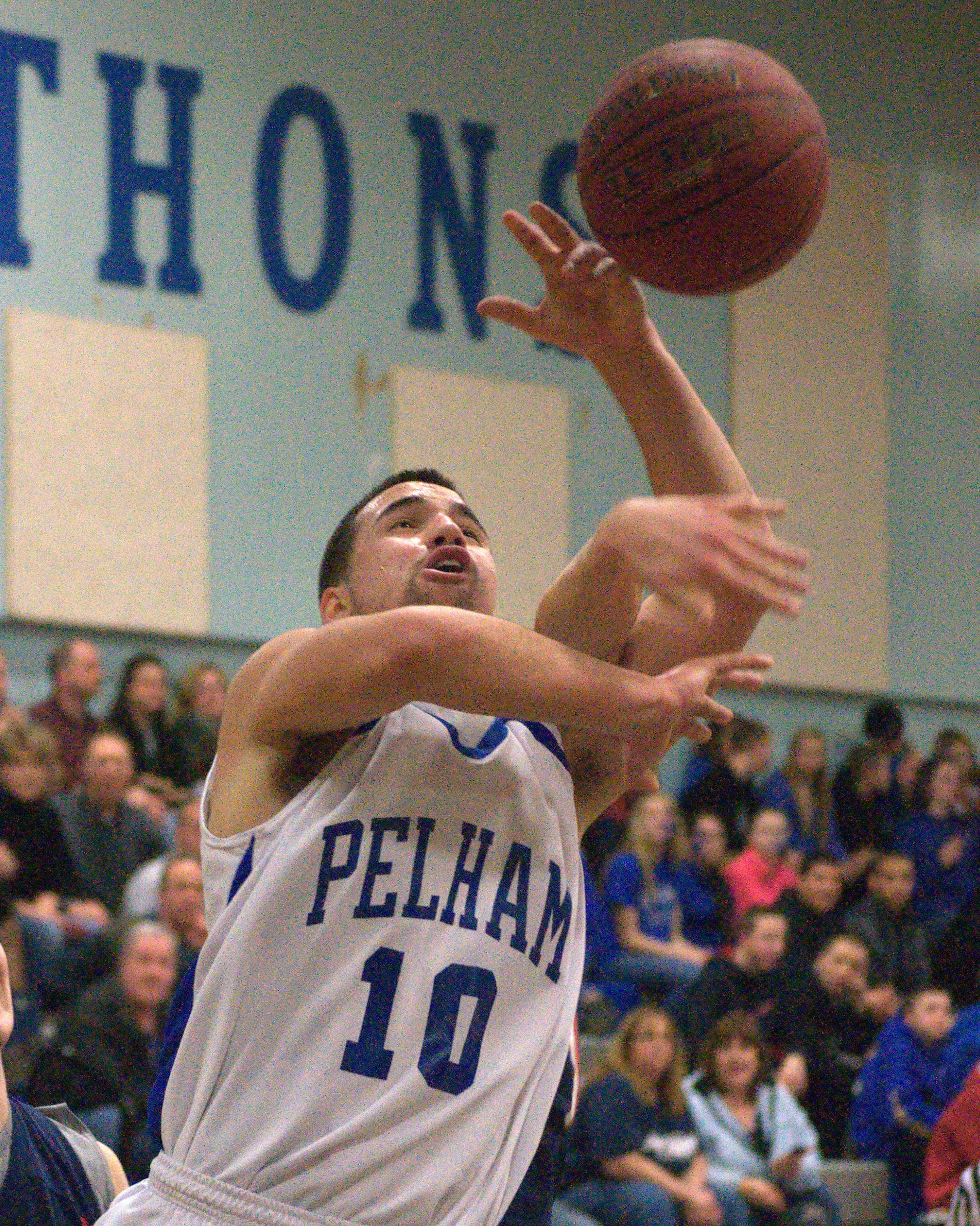 Pelham's Jake Vaiknoras is fouled on his way to the basket during Thursday's game. For more photos, go to the Photo Album.
