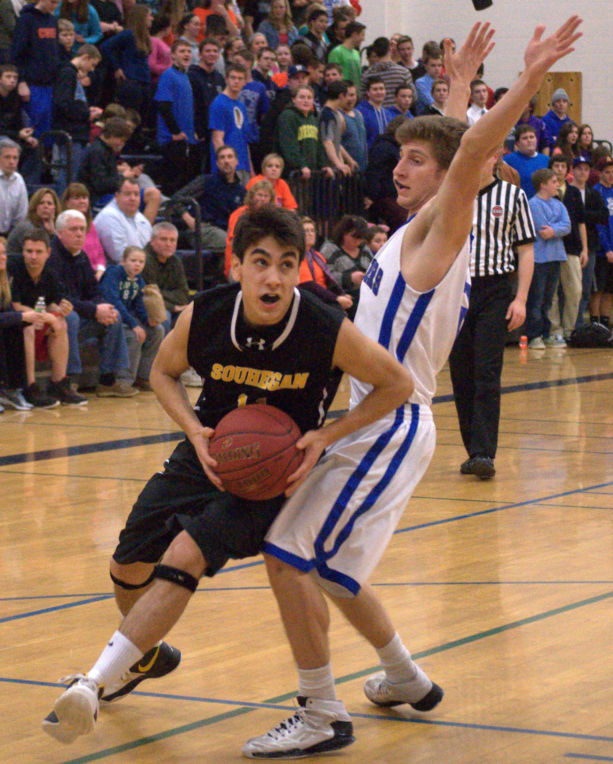Souhegan's Brandon Len drives around Hollis Brookline's Connor Walsh.