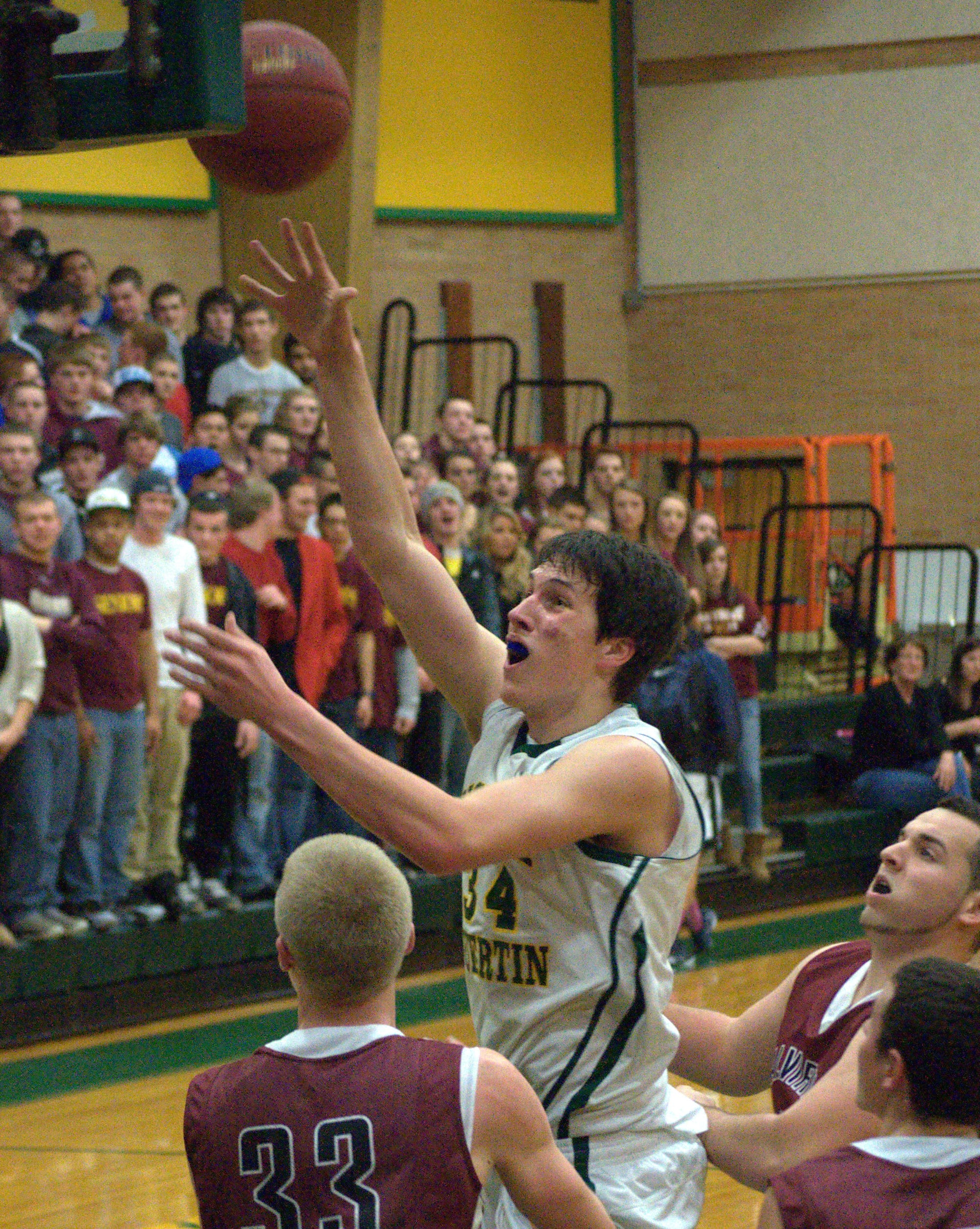 Bishop Guertin's Jeff Lunn puts up a shot during Tuesday's playoff game against Alvirne. Lunn and the Cardinals will play at Manchester Central on Friday.