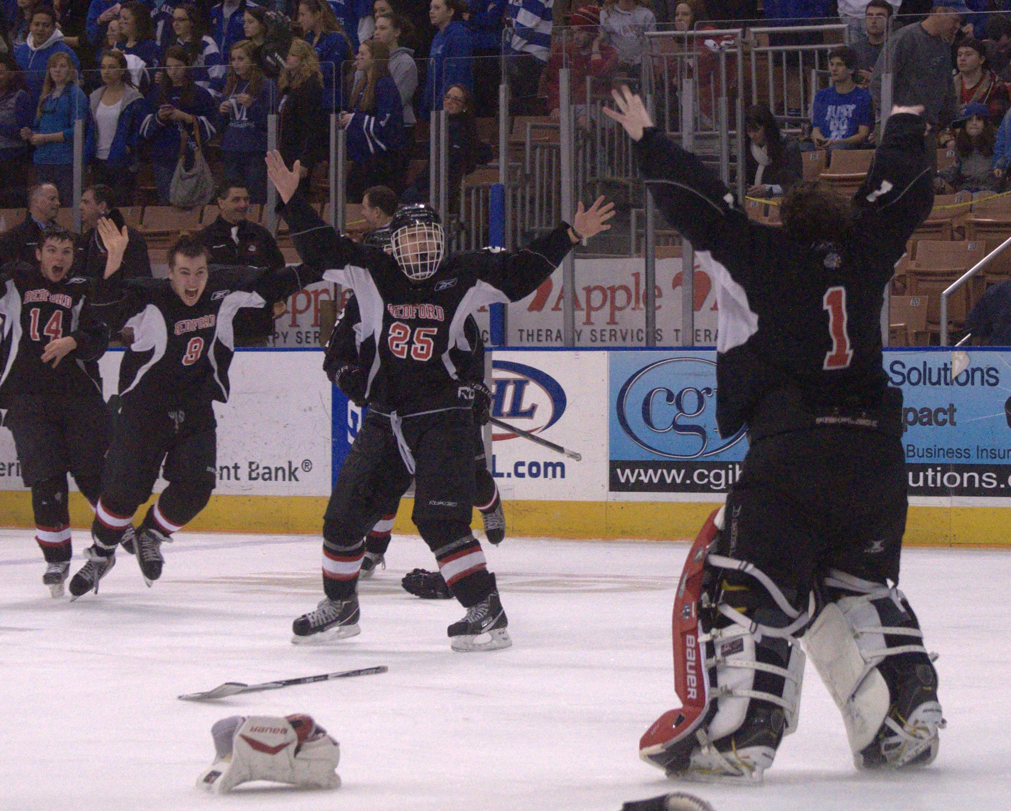 Bedford goalie Stevan Tempesta (No. 1) and the Bulldogs celebrate after winning the Division II championship. For more photos, go to the Photo Album.