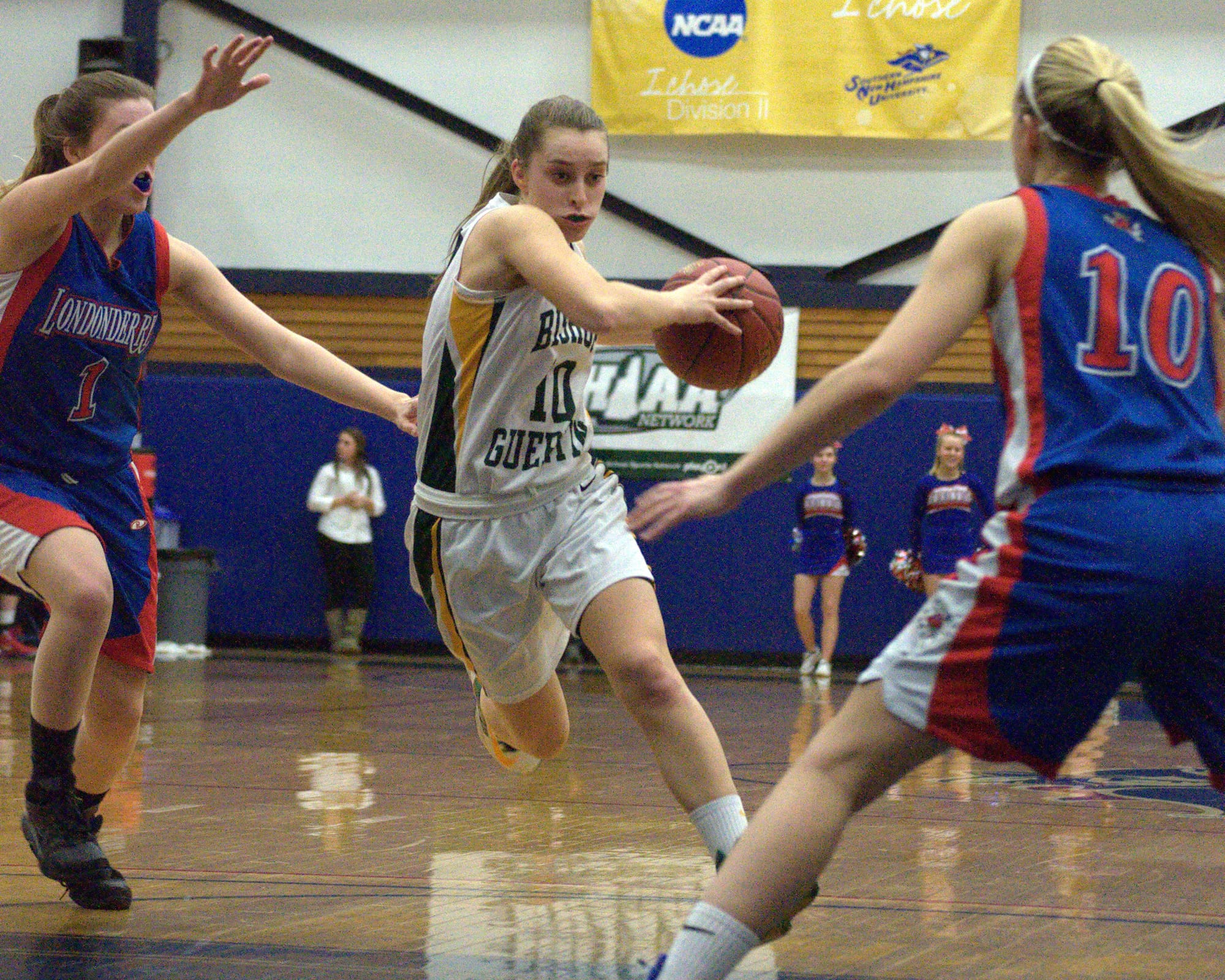 Bishop Guertin's Jamie Sherburne tries to find a hole in the Londonderry defense.