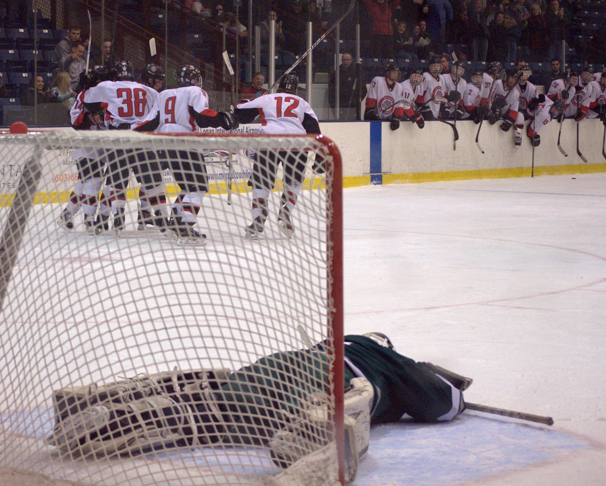 Kingswood goalie Shawn Goggin lays on the ice after Bedford's Chris O'Hara (No. 38) scored late in the second period Saturday. 