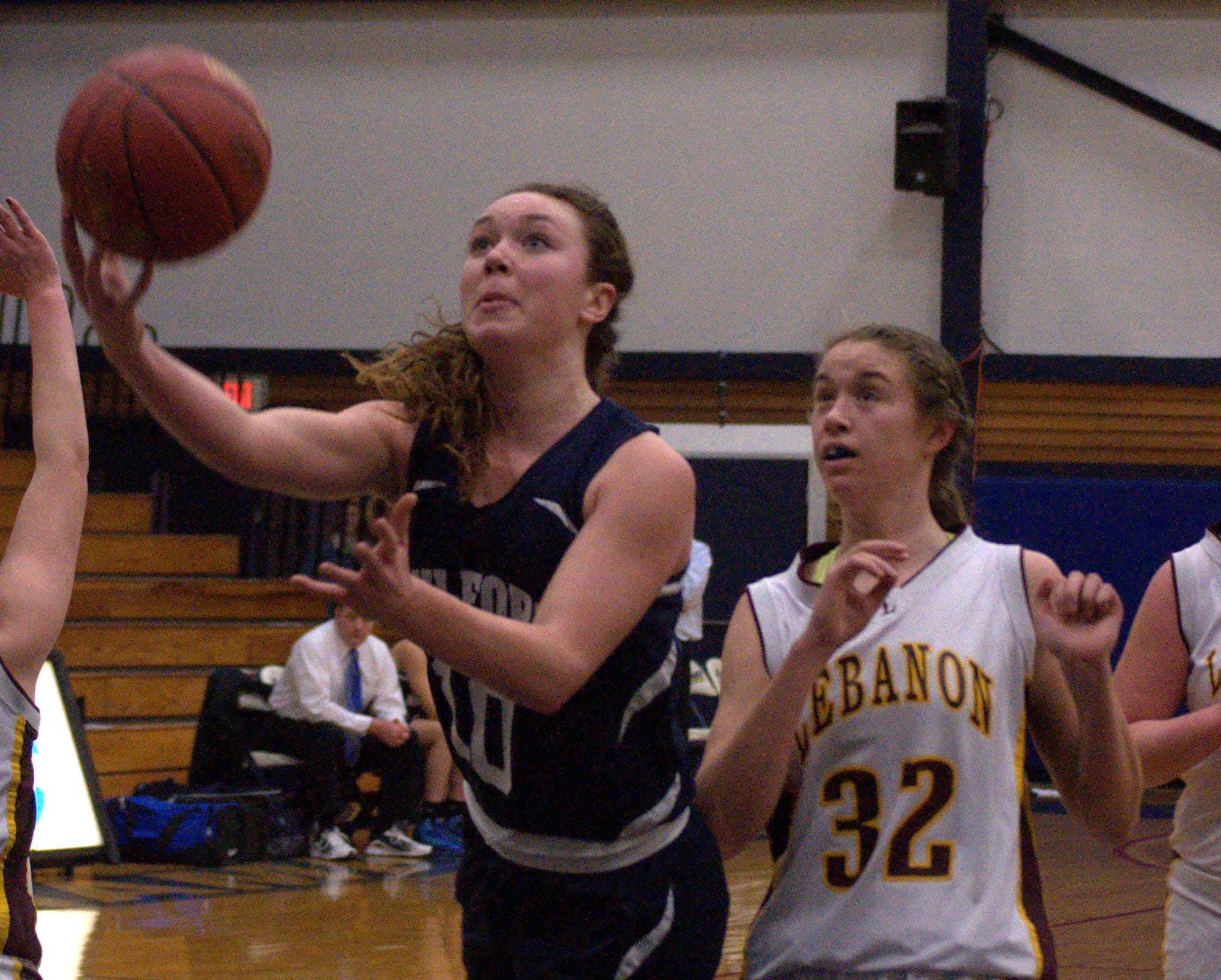 Milford's Dina Pitsas goes in for a layup as Lebanon's Heather King defends during Monday's game. For more photos, go to the Photo Album.