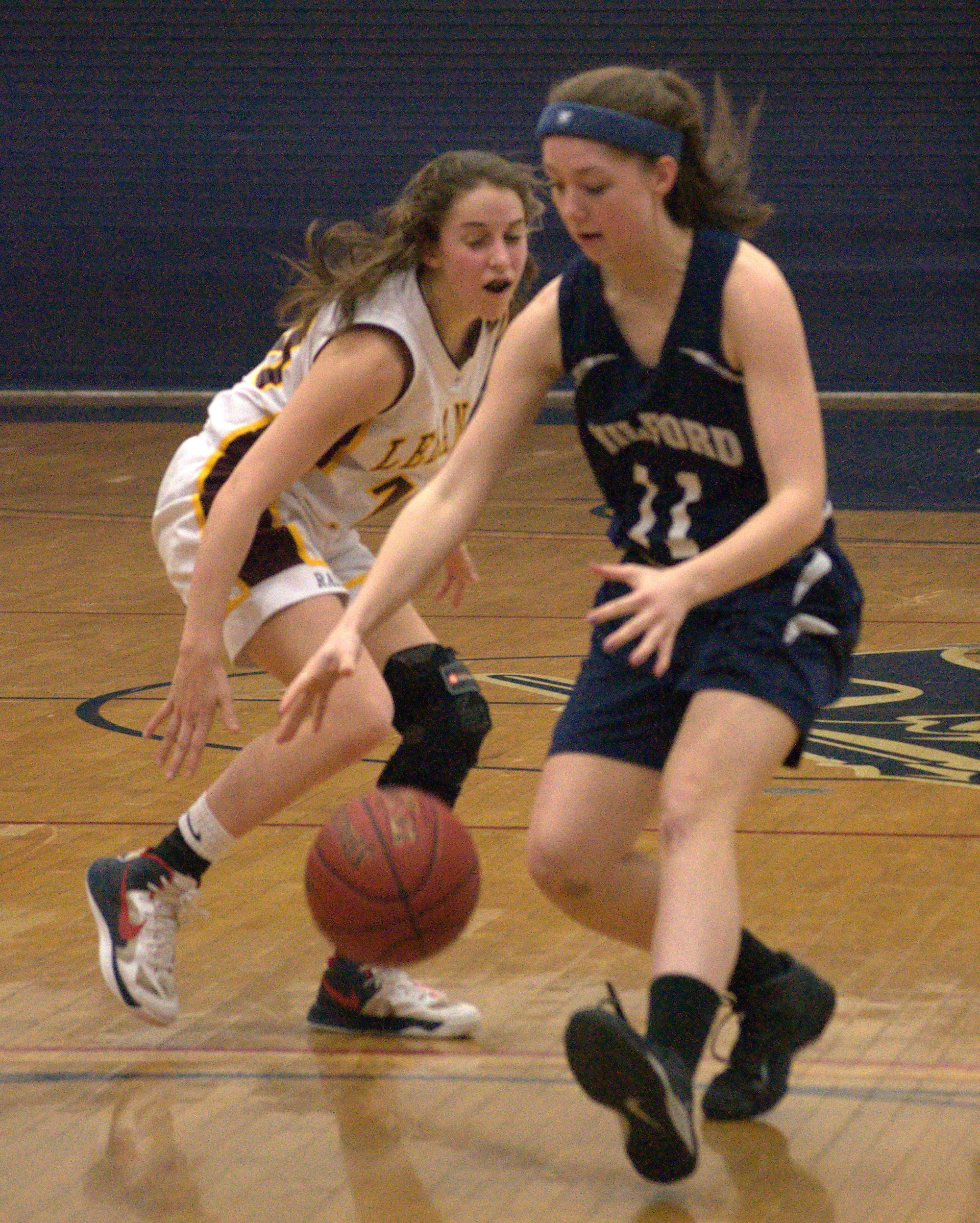 Milford's Kaitlyn Matthews tries to grab a loose ball.