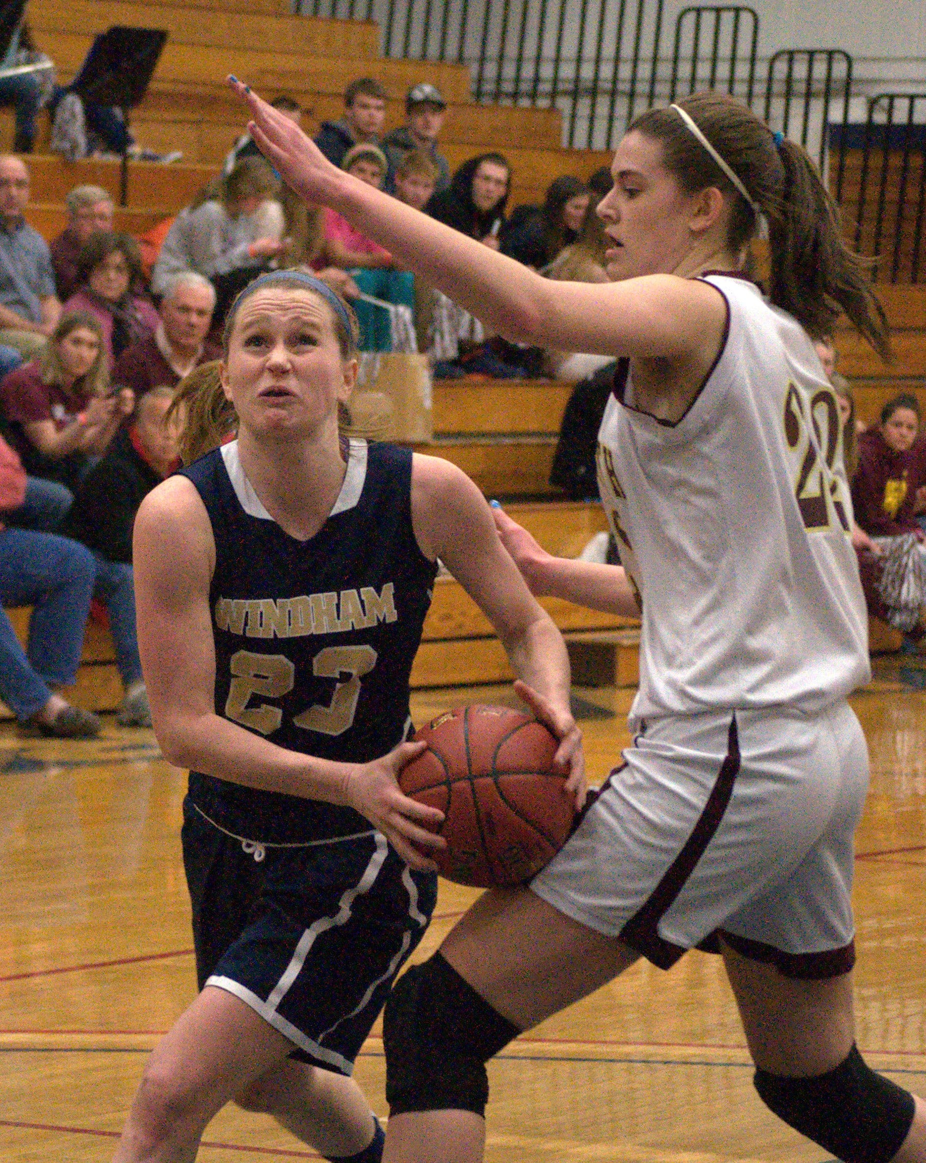 Windham's Bernadette Connors drives to the basket as Portsmouth's Alicia Brown defends.
