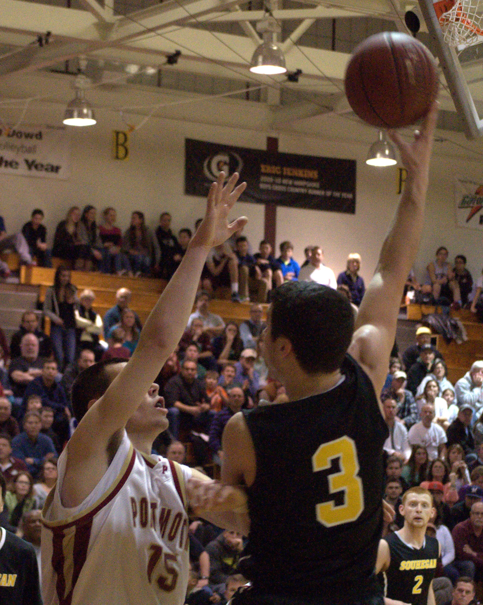 Souhegan's Tyler Ford puts up a shot.
