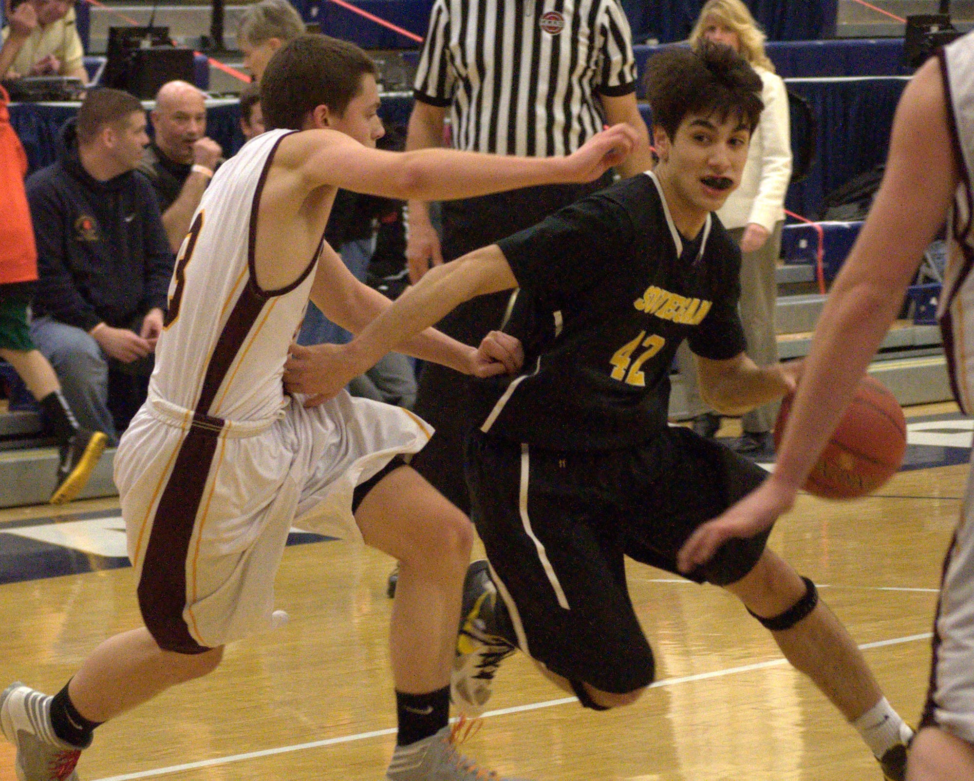 Souhegan's Brandon Len drives to the basket.