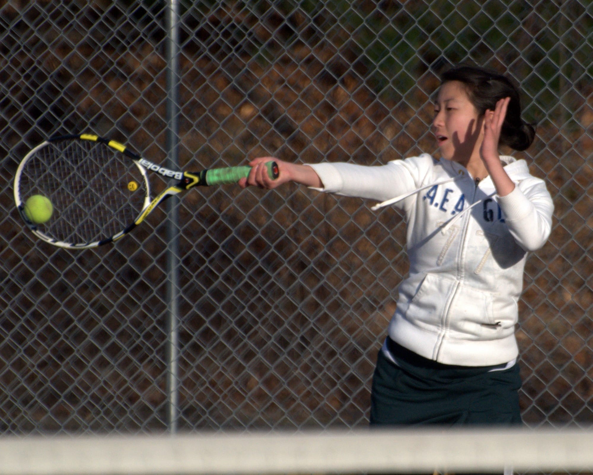 Bishop Guertin's Jennifer Dai returns a shot during a match Monday against Bedford. For more photos, go to the Photo Album.