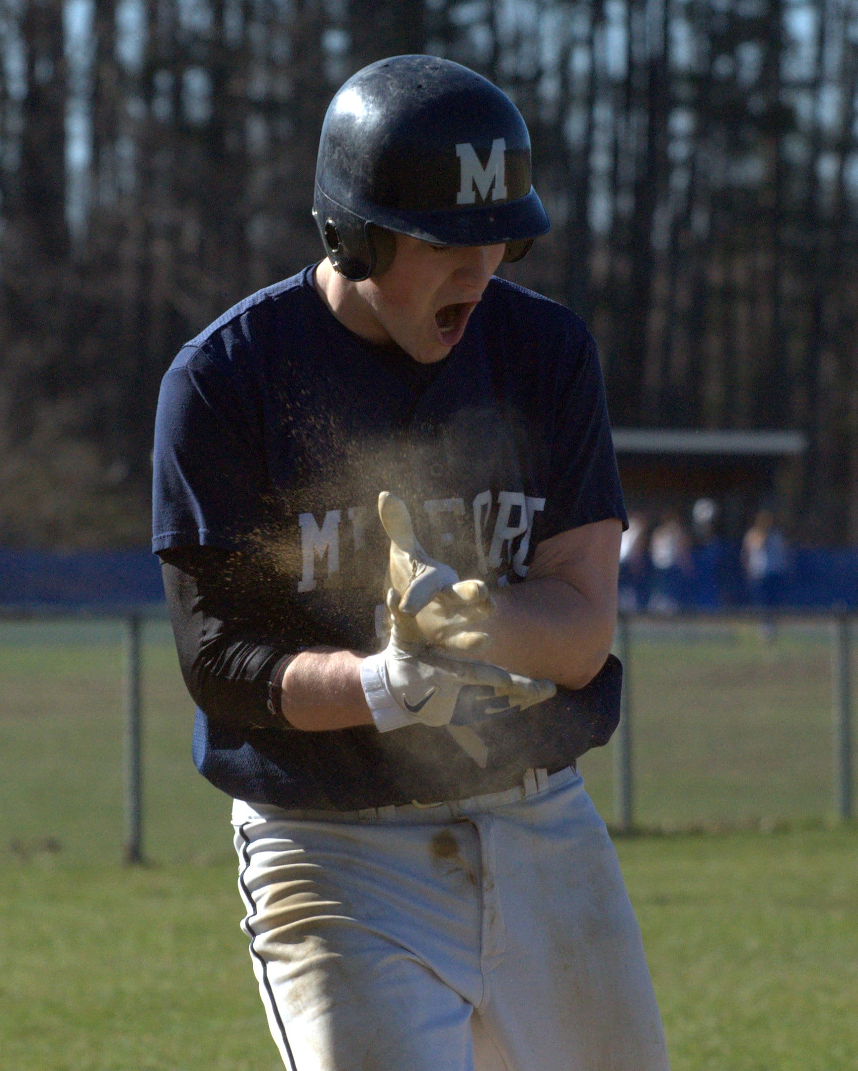 Milford's Bret Stagnone celebrates after scoring a run during Wednesday's game against Souhegan.