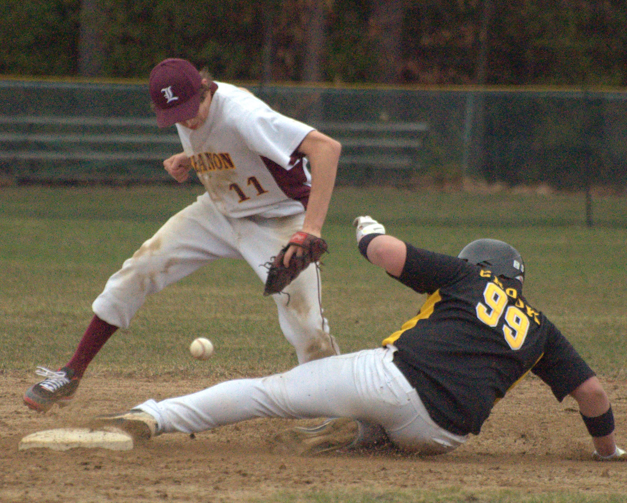 Lebanon's Cam Broughton can't hang on to the ball as Souhegan's Cam Crook slides into second.