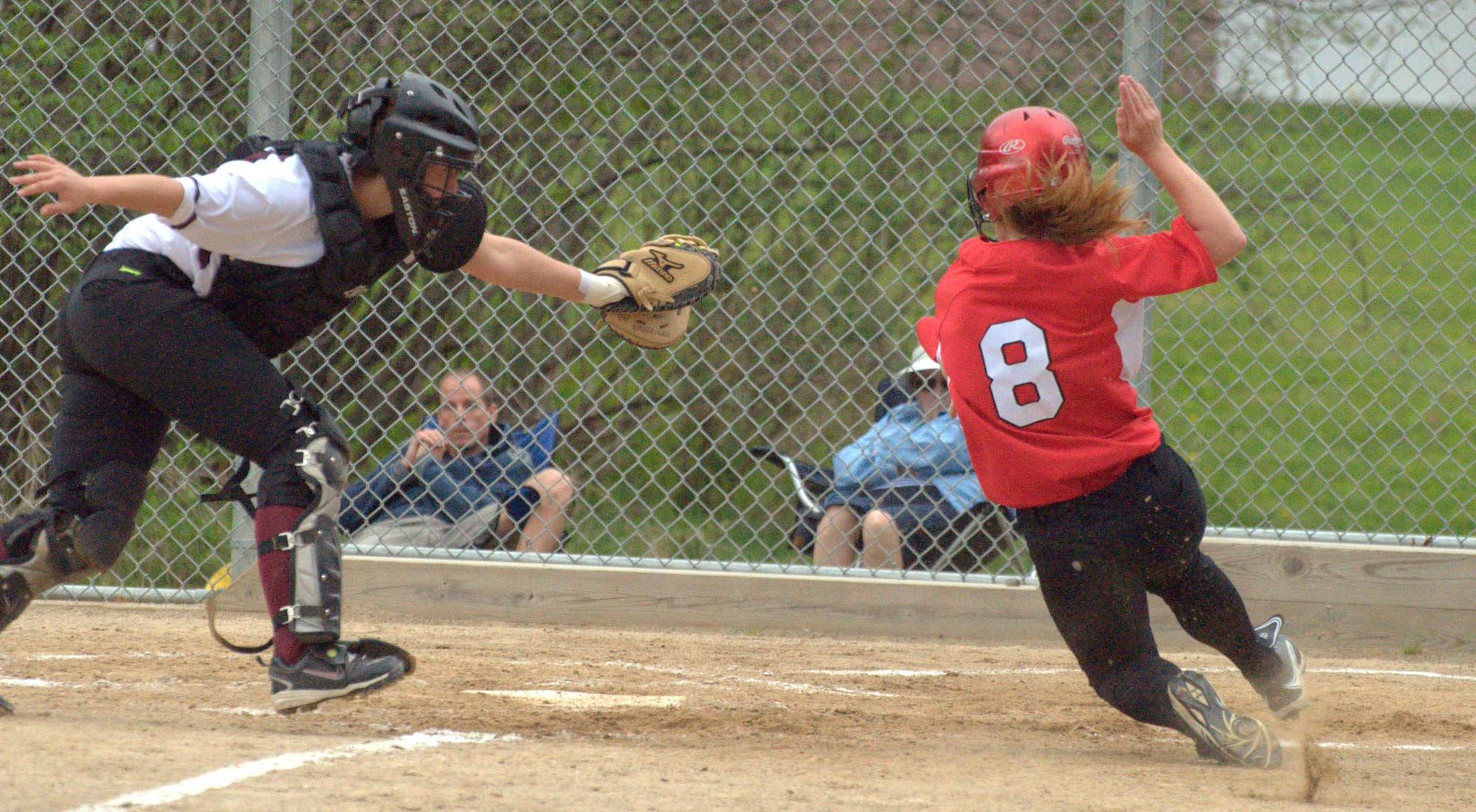Bedford's Kelsey Kennedy gets around the tag of Alvirne's Evelyn Susko.