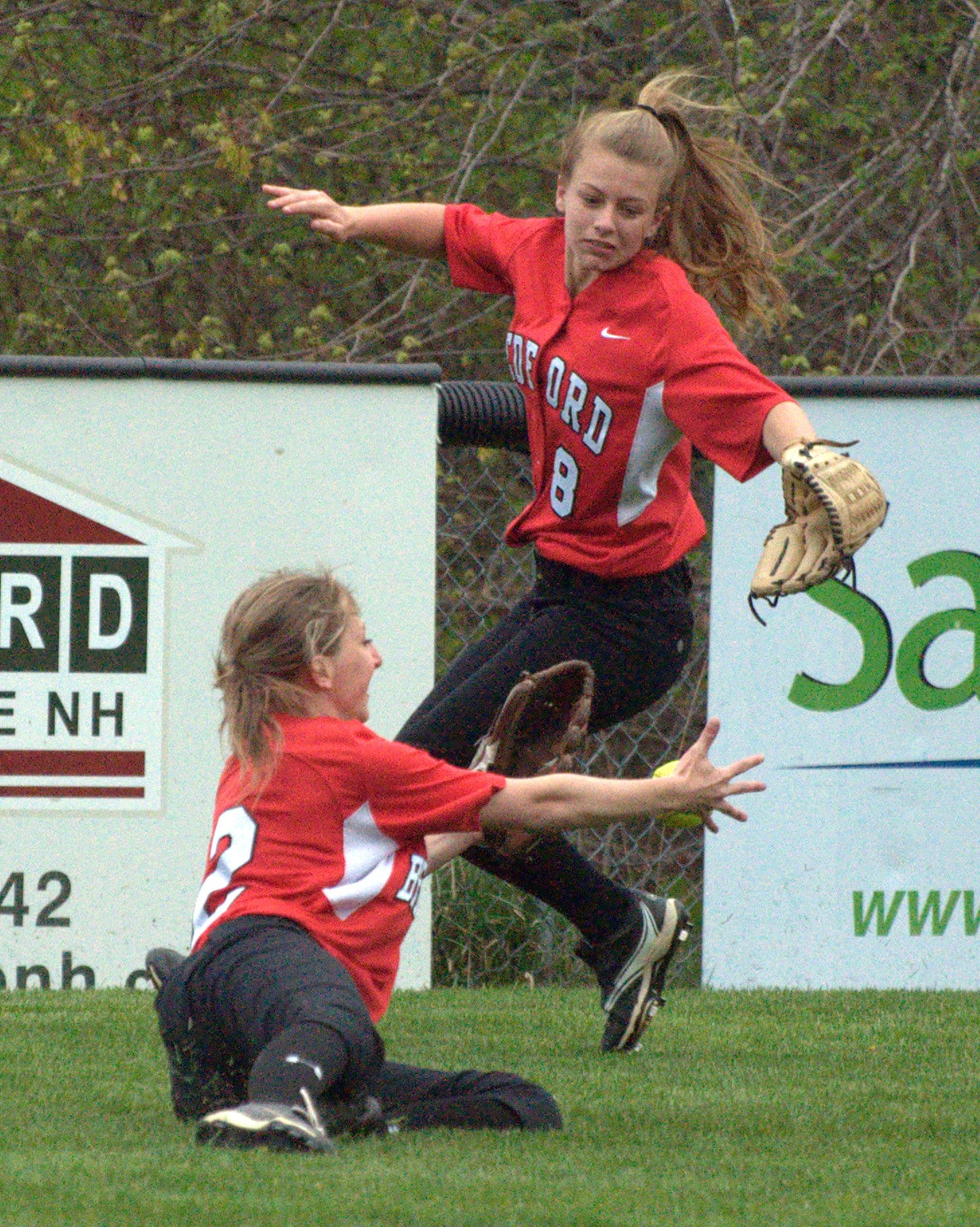 Bedford's Alison Durkin, left, and Kelsey Kennedy can't come up with this fly ball during Wednesday's game. For more photos, go to the Photo Album.