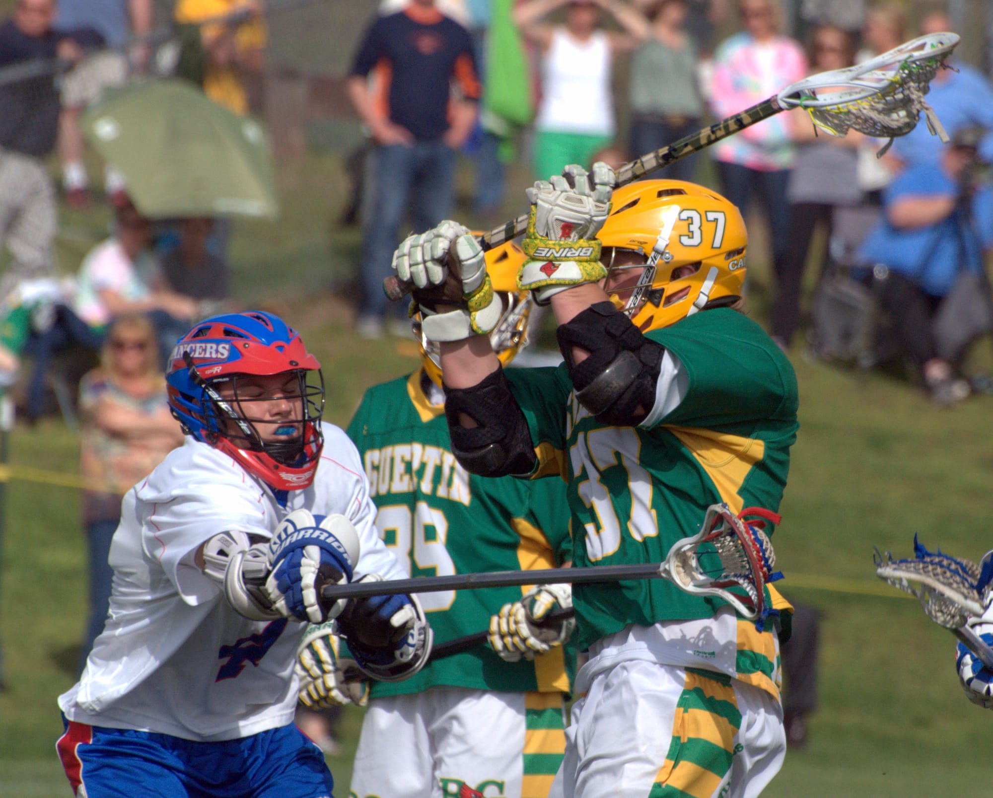Bishop Guertin's John Miller takes a shot as Londonderry's Aron Gaudet tries to defend. For more photos, go to the Photo Album.