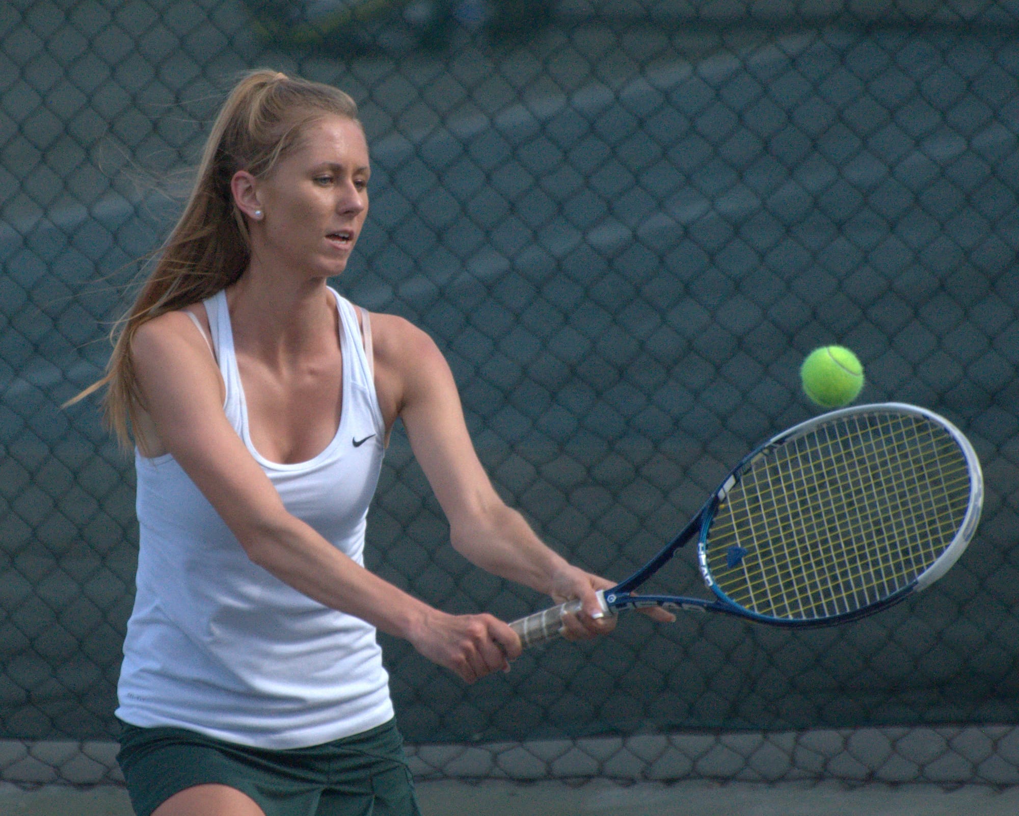 Bishop Guertin's Briana Leonard hits a backhand during Thursday's Division I championship against Bedford.