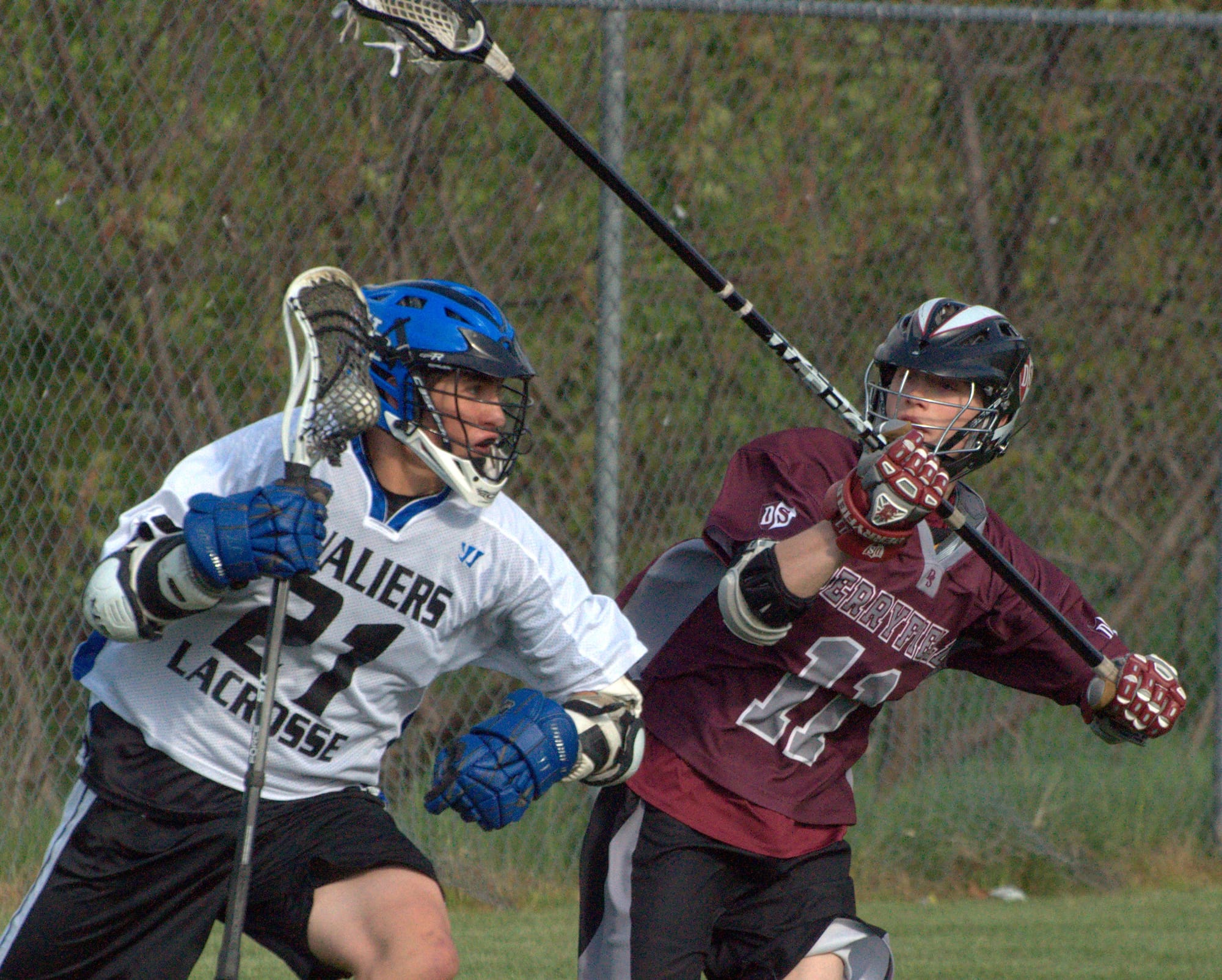 Derryfield's John Lenecki tries to slow down Hollis Brookline's Ryan Papineau during Tuesday's game.