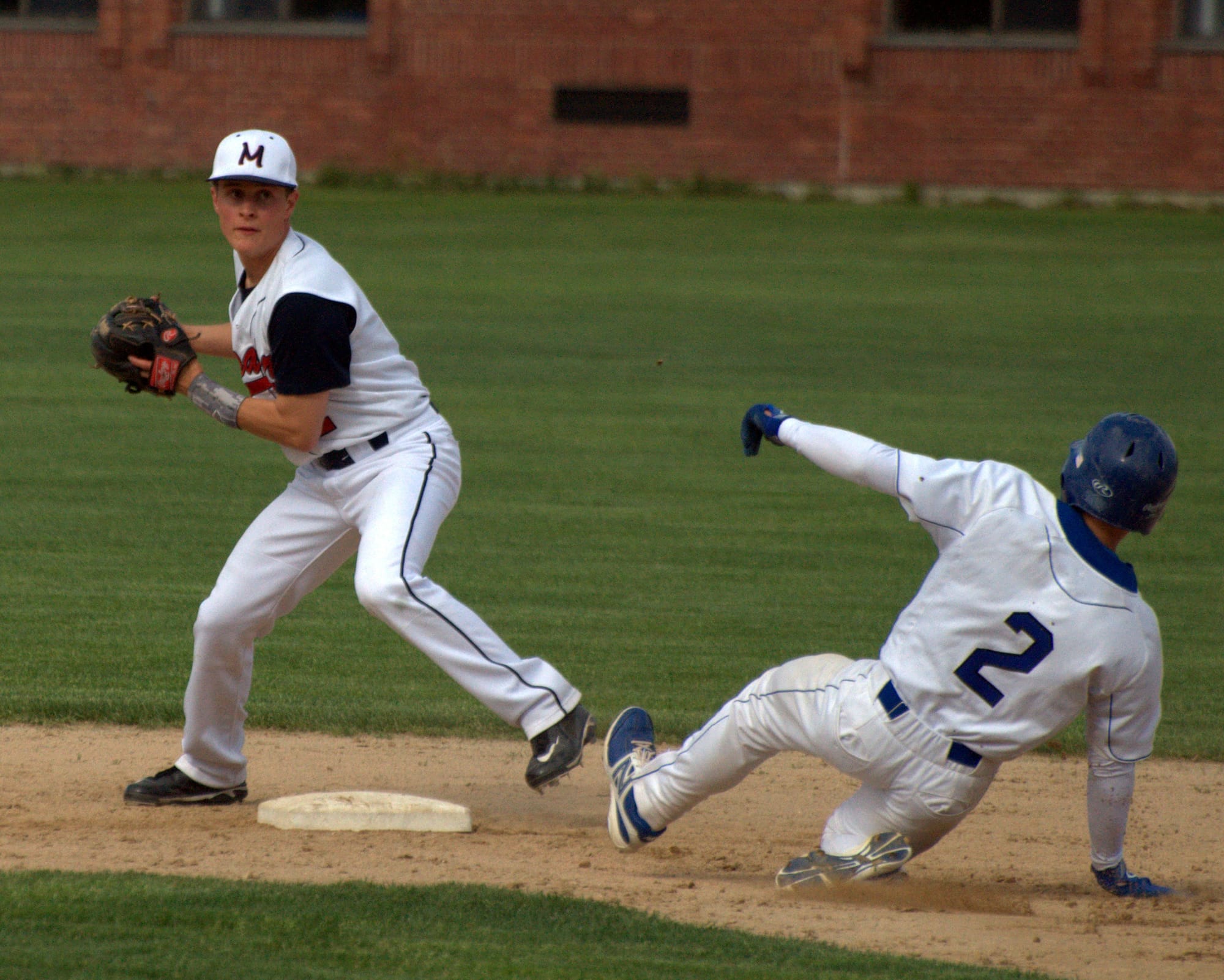 Memorial's Kevin Gonzales gets the out at second as he tries to turn a double play.