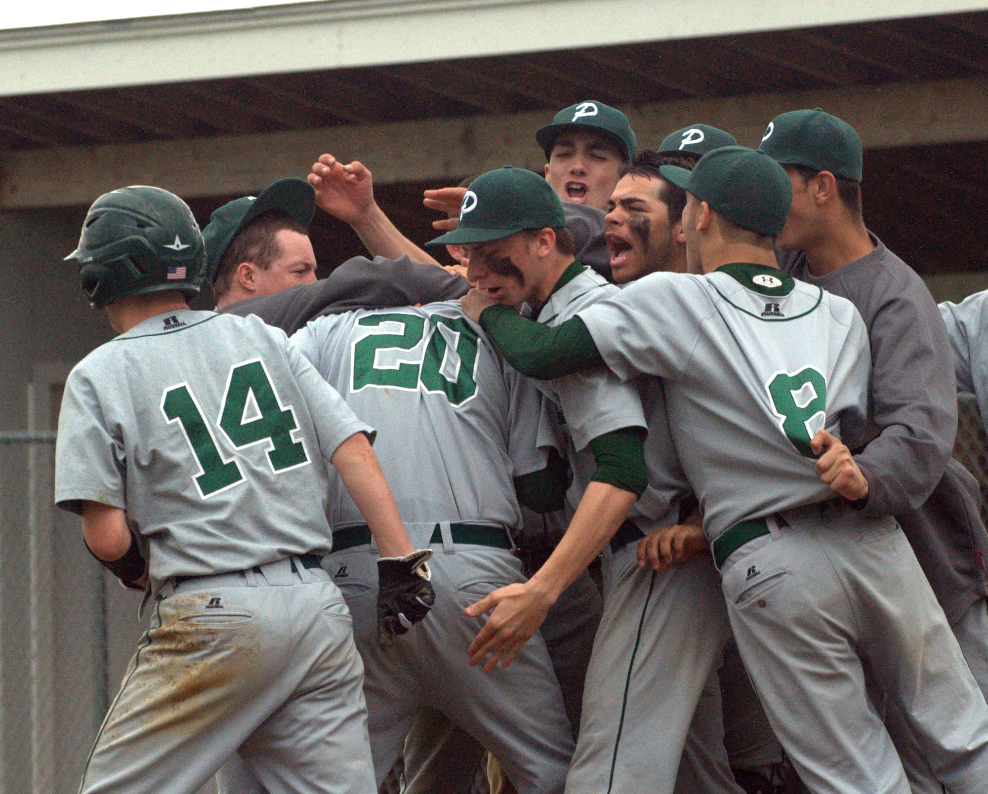 The Pembroke baseball celebrates after Seth Gonya (No. 20) hit a grand slam.