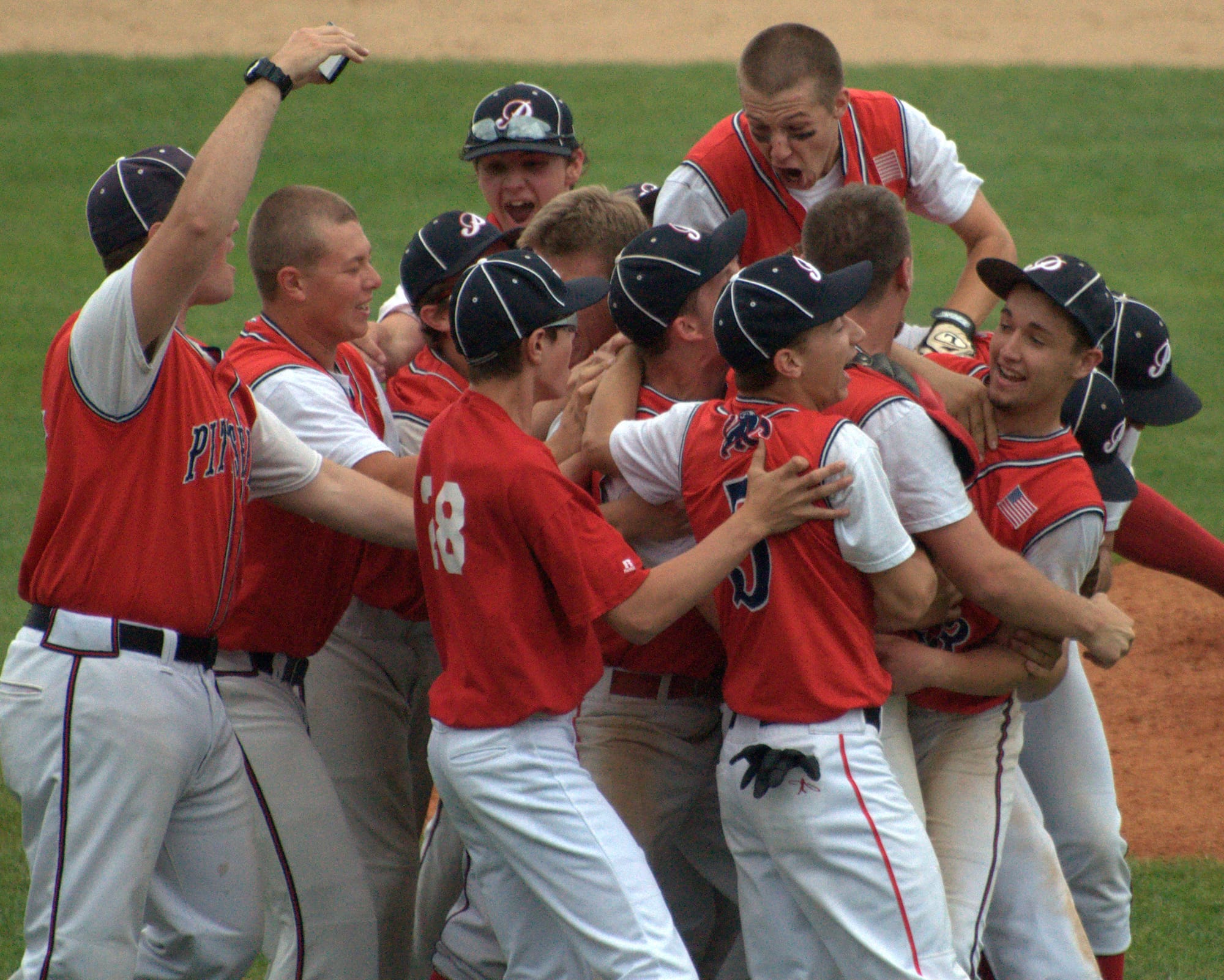 Members of the Pittsfield baseball team celebrate after beating Littleton in the Division IV title game.