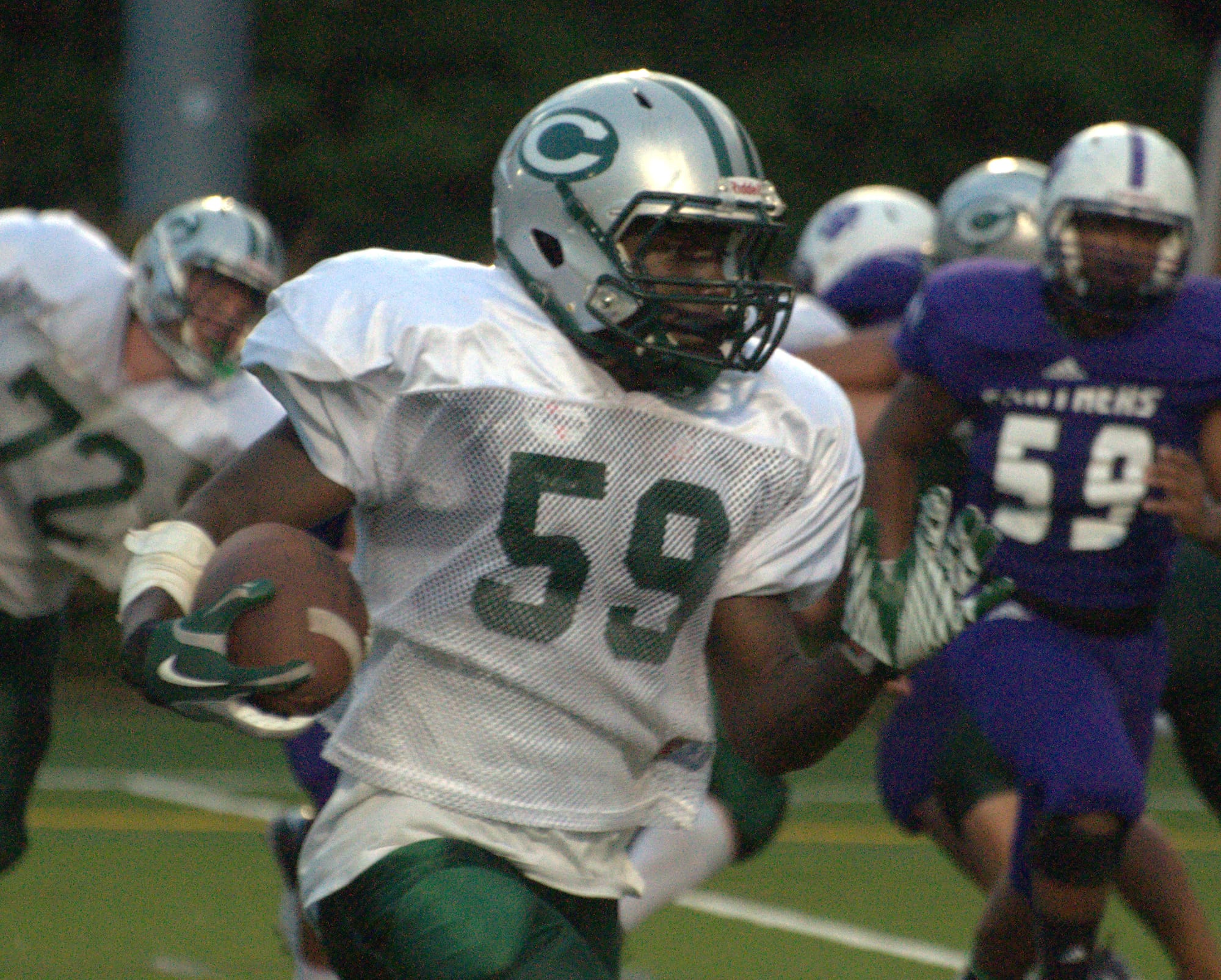 Manchester Central's Jesiah Wade carries the ball during Wednesday's scrimmage against Nashua South.
