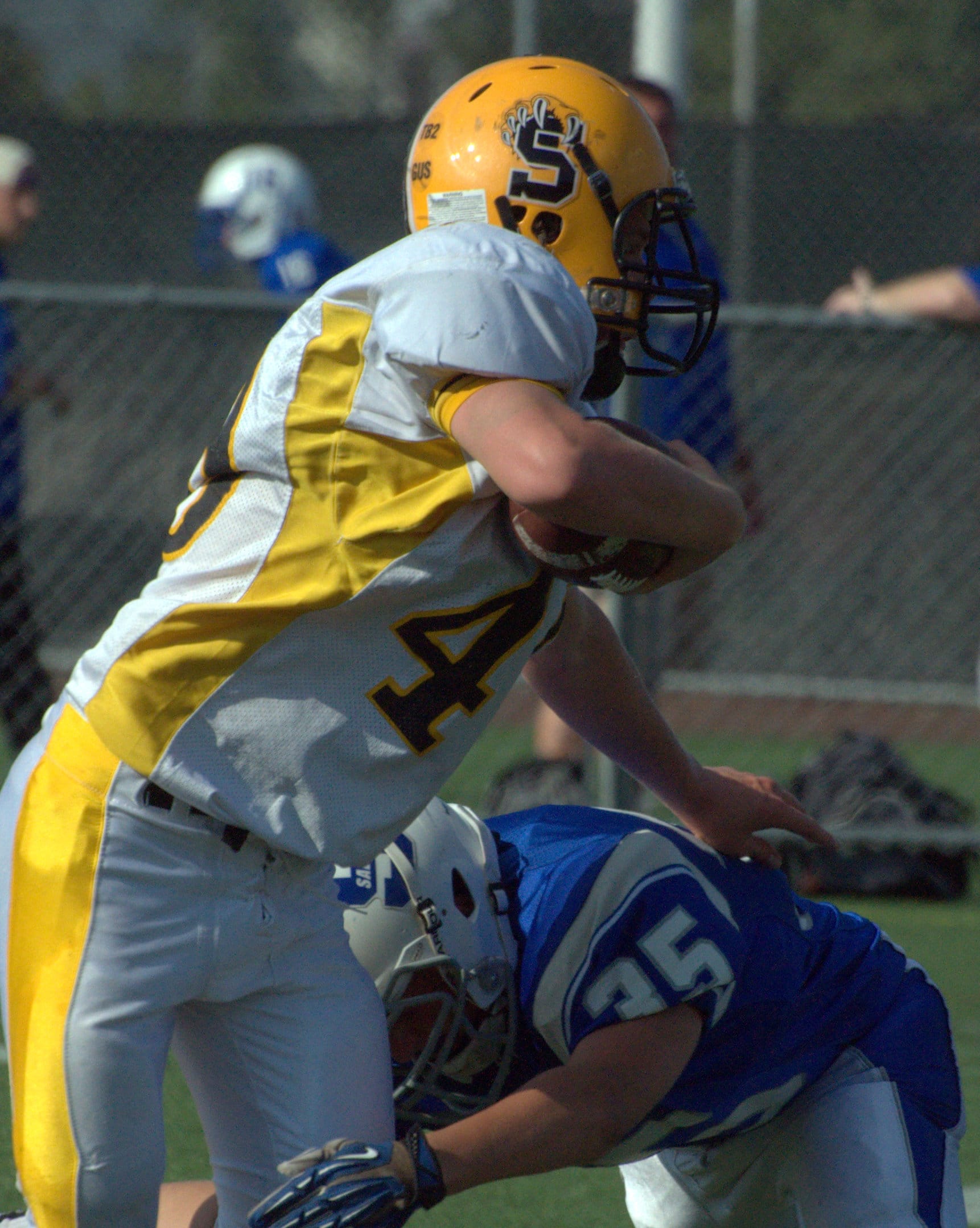 Souhegan's Cameron Kinney tries to break a tackle during Friday's scrimmage against Salem.