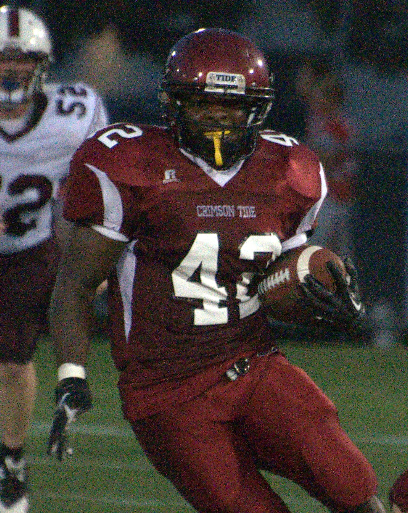 Concord's Walter Ndi carries the ball during Friday's scrimmage against Goffstown.