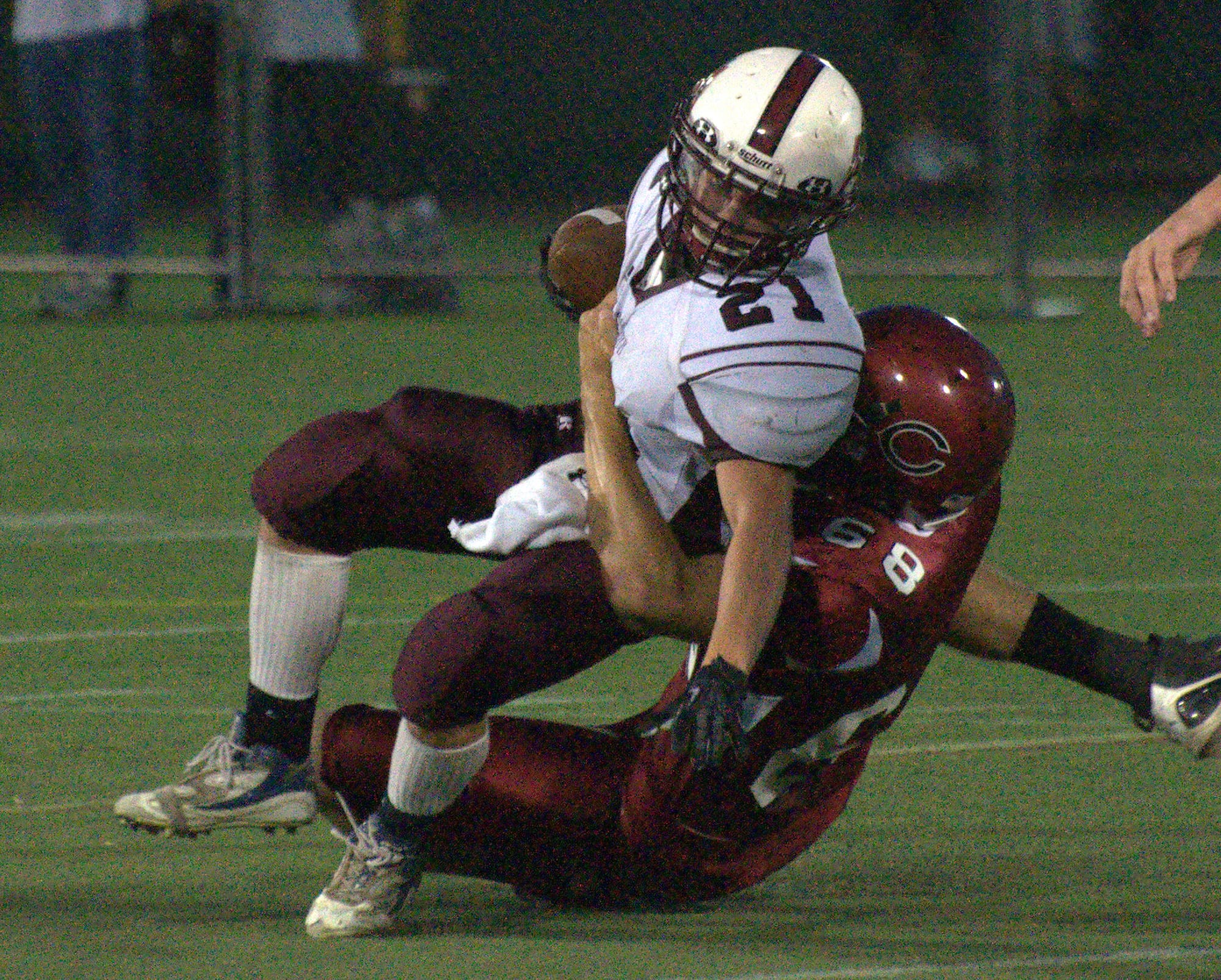 Goffstown's Connor Bourque is brought down by Concord's Calvin Crowell during last Friday's scrimmage.