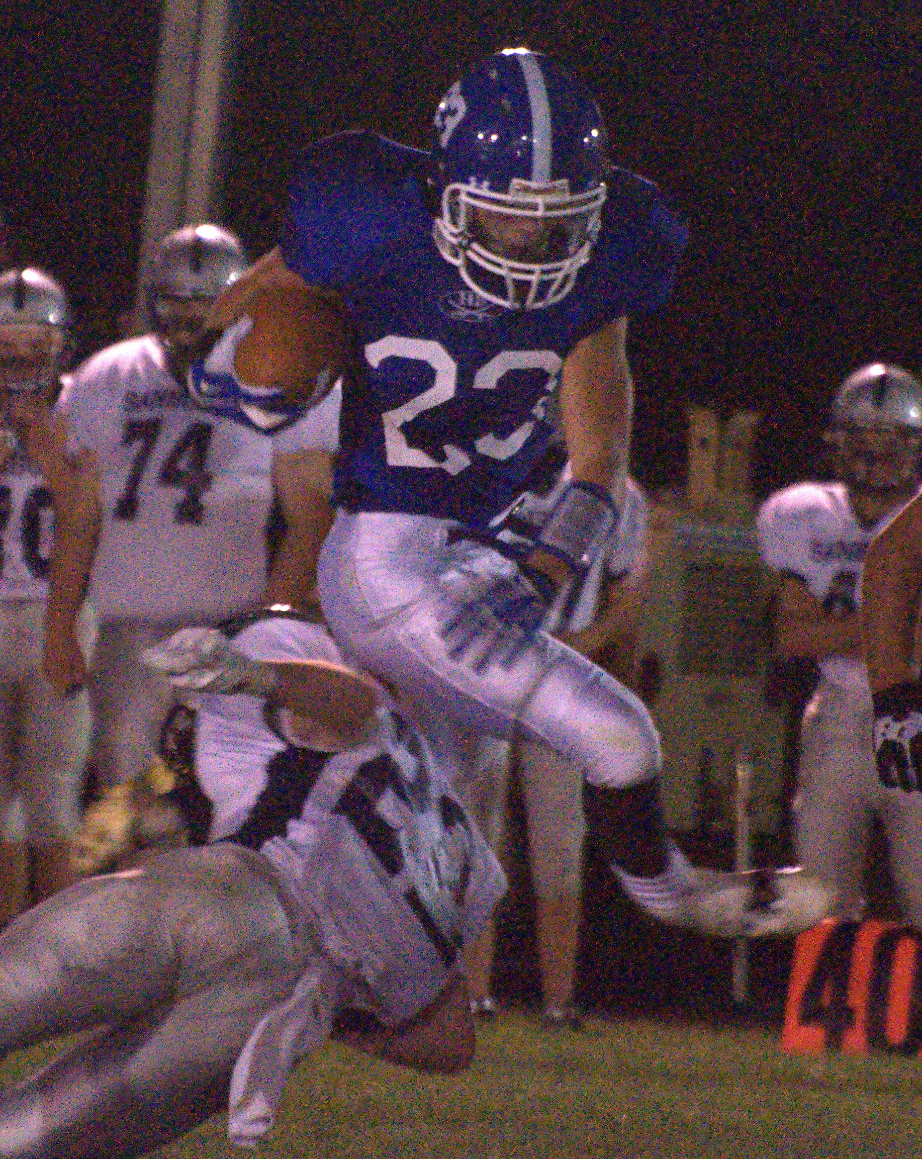 Hollis Brookline's Joe Brooks tries to avoid a tackle during Saturday's game.