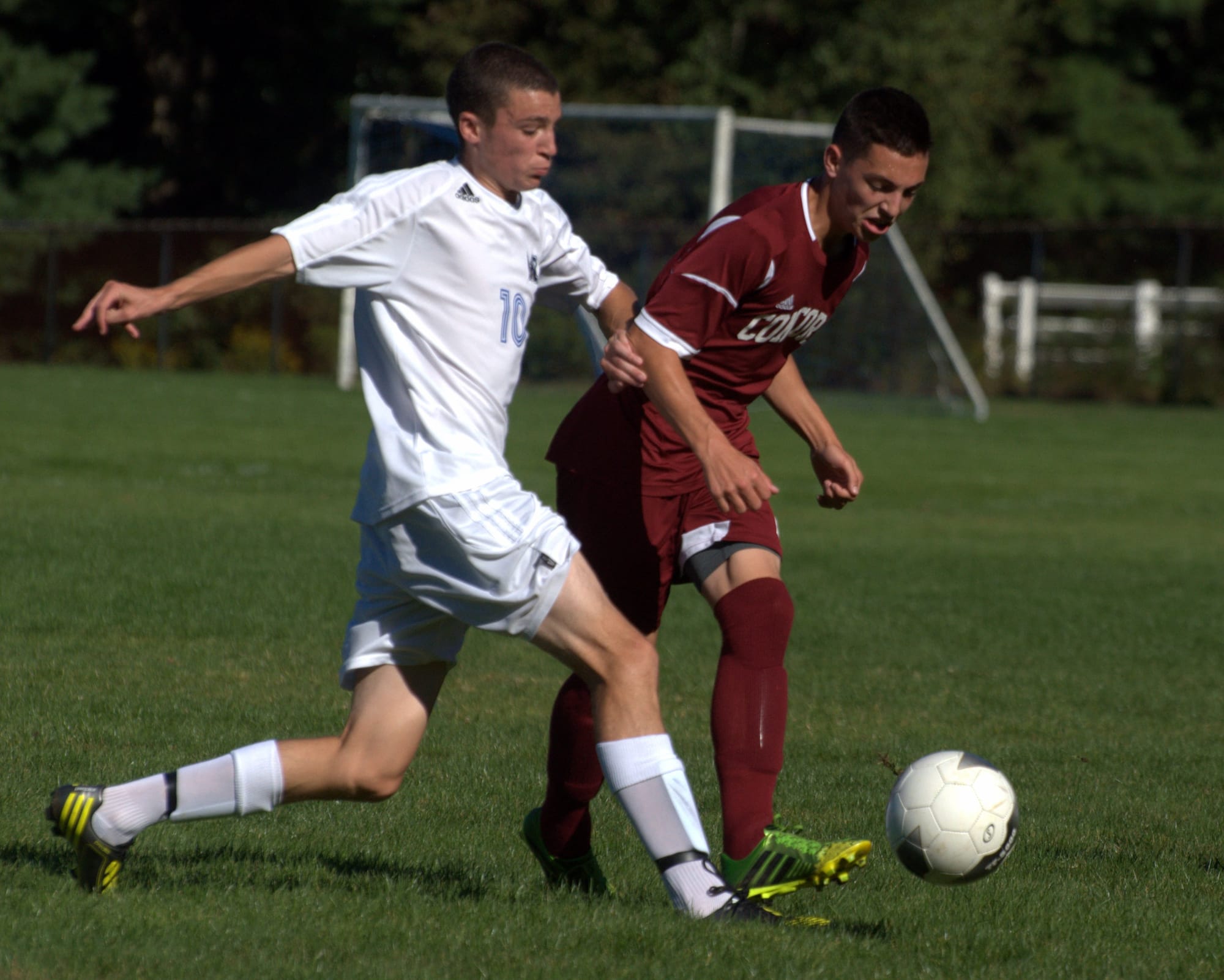 Merrimack's Steven Sexton battles for the ball with Concord's Mathew Chartier during Thursday's game.