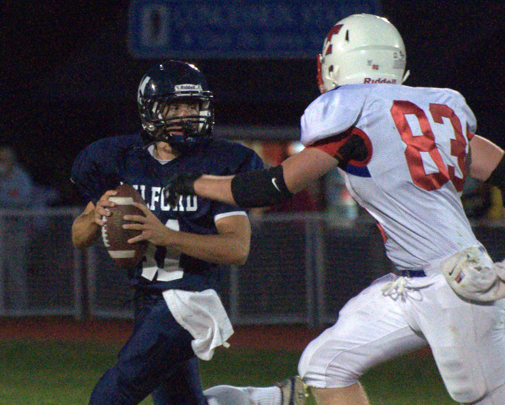 Milford's Harrison Urda looks for a receiver during Friday's game against Trinity.