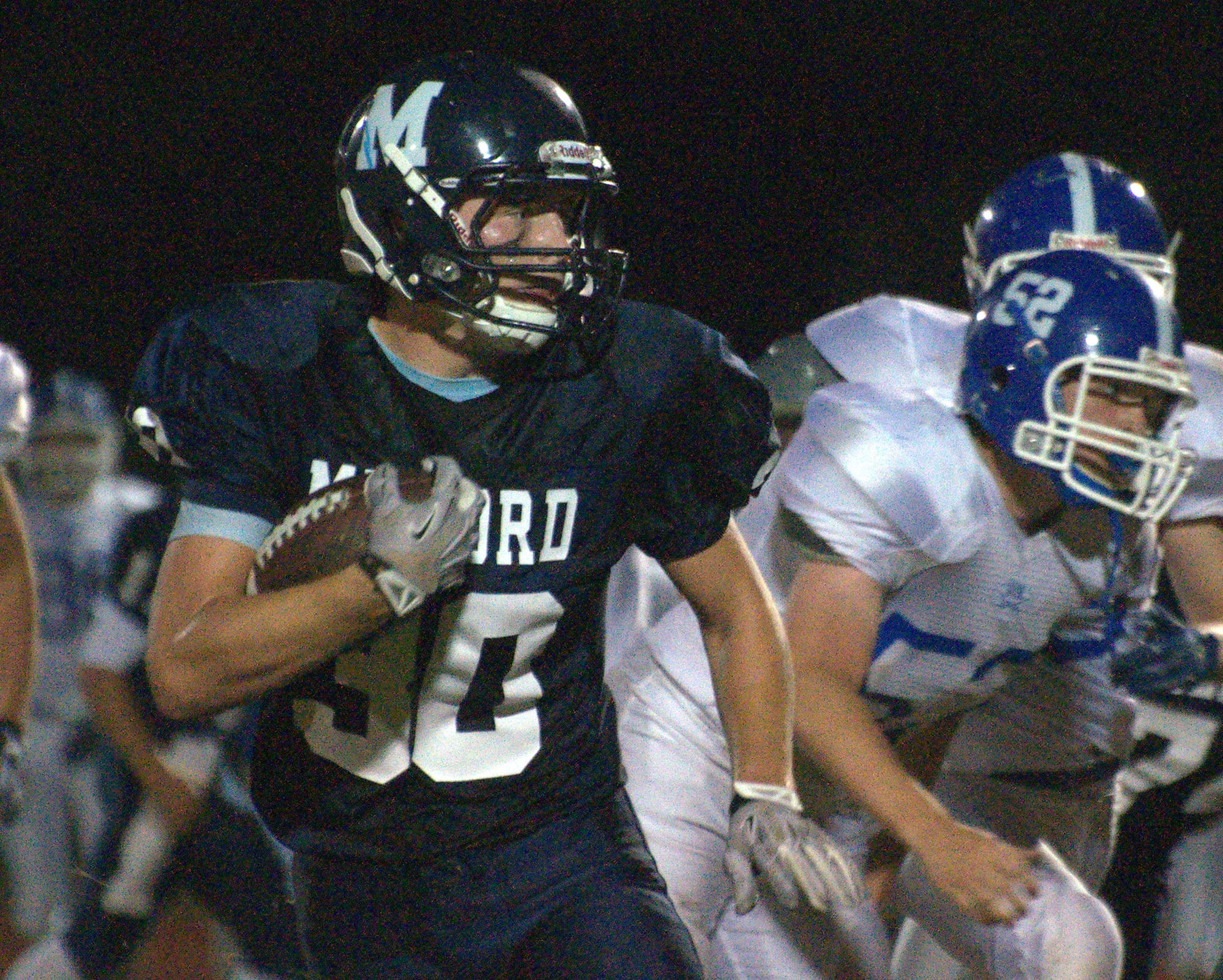 Milford's Evan Perron carries the ball during Friday's game against Hollis Brookline.