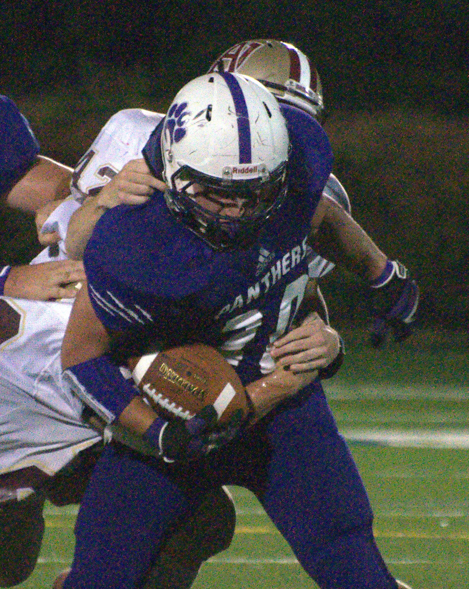 Nashua South's Andrew DeCarteret tries to fight off a tackle during Thursday's action. For more photos, go to the Photo Album.