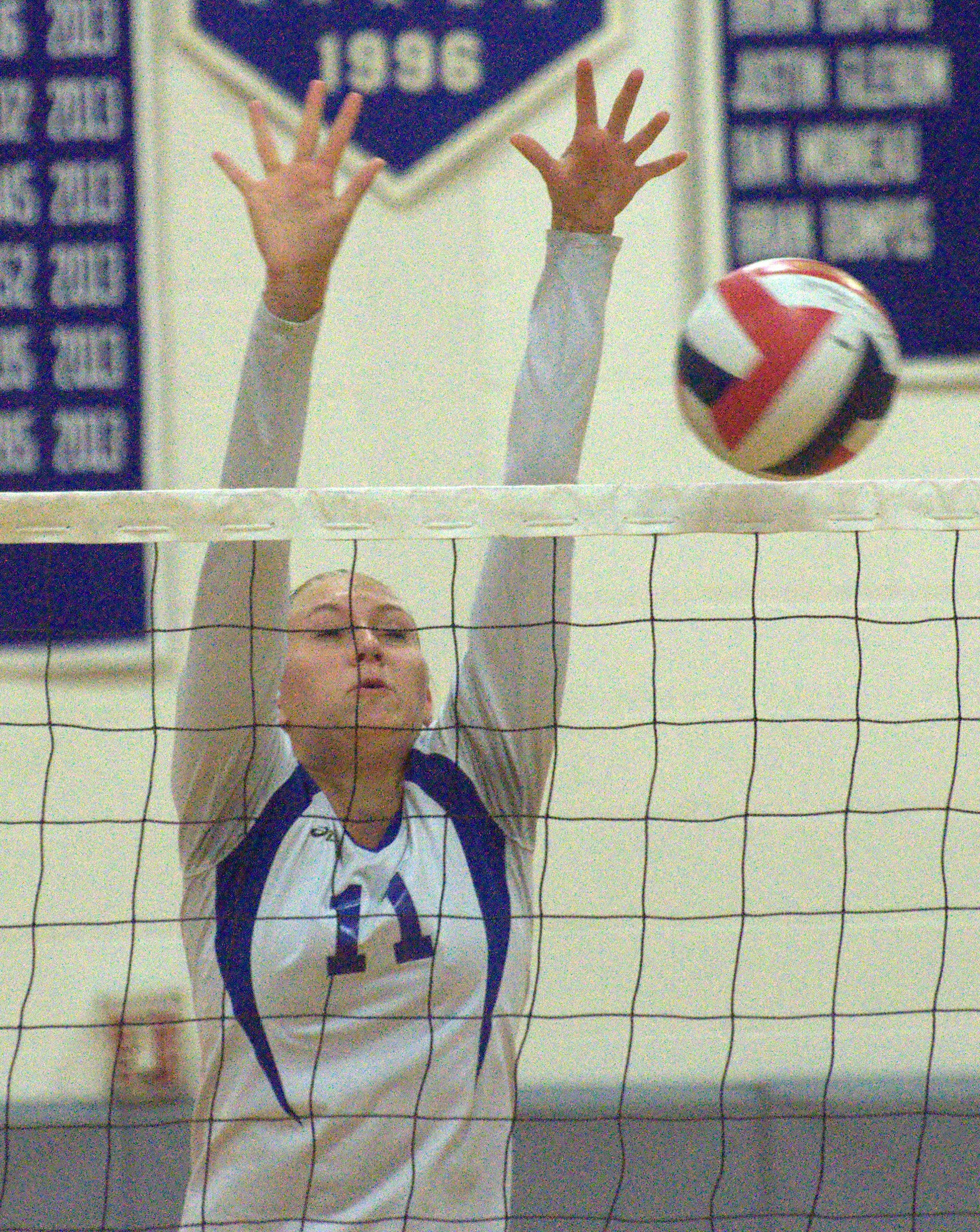 Salem's Olivia Burke goes up for a block during Wednesday's match at Hollis Brookline. For more photos, go to the Photo Album.