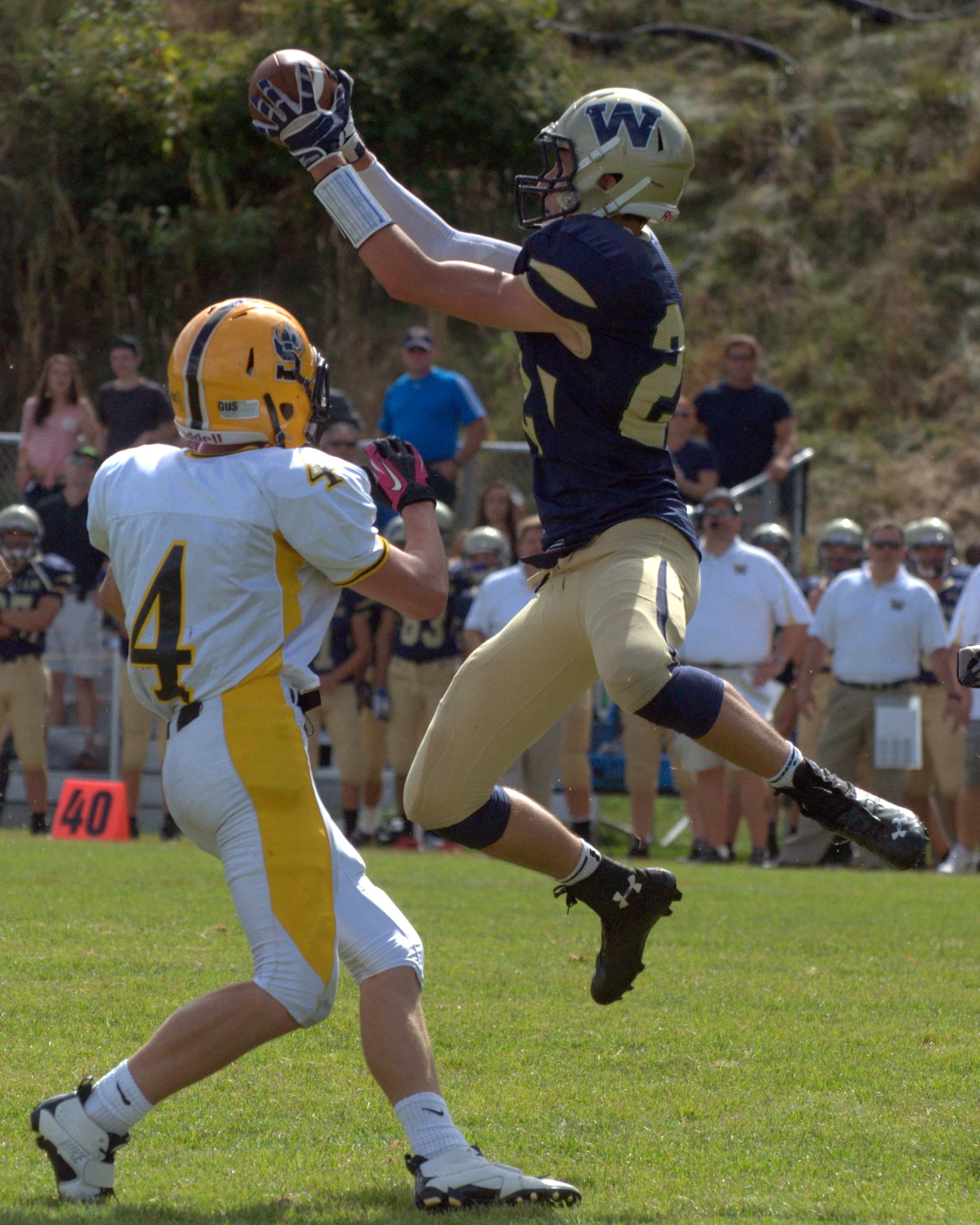 Windham's Joey Frake tries to haul in a pass during Saturday's game against Souhegan.