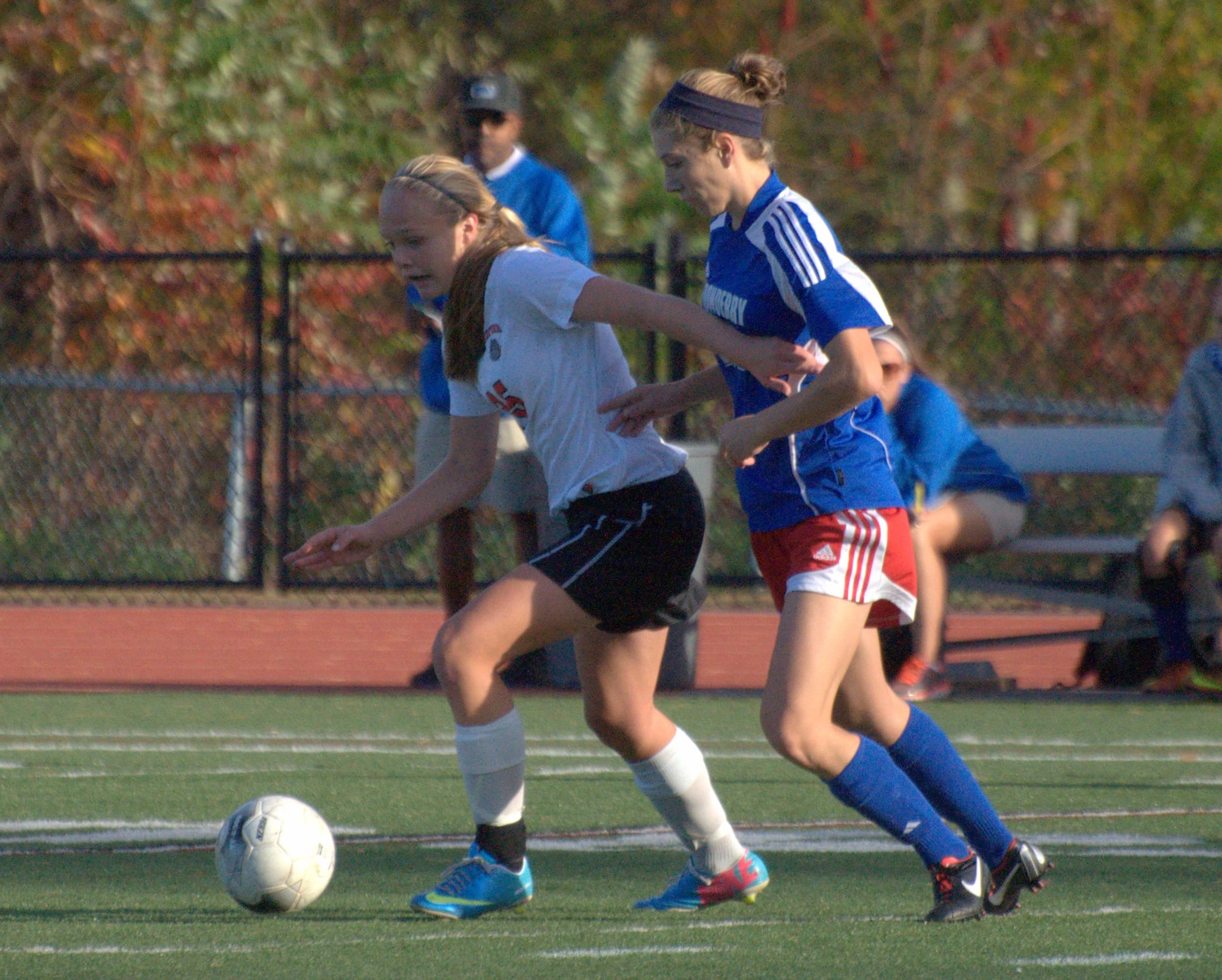 Bedford's Saylor Clark tries to keep Londonderry's Jaimee Cava away from the ball during Tuesday's game. The teams played to a 1-1 draw.