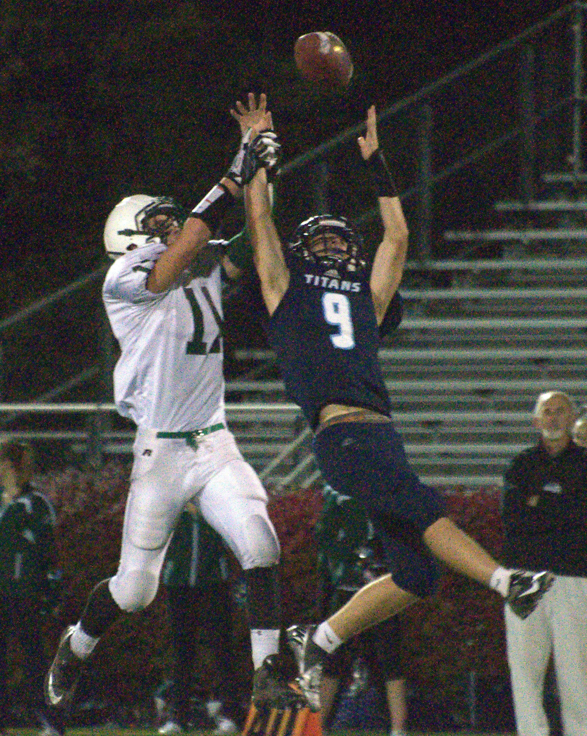 Dover's Darren Correnti and Nashua North's Brandon Martin go up for a ball during Saturday's game.