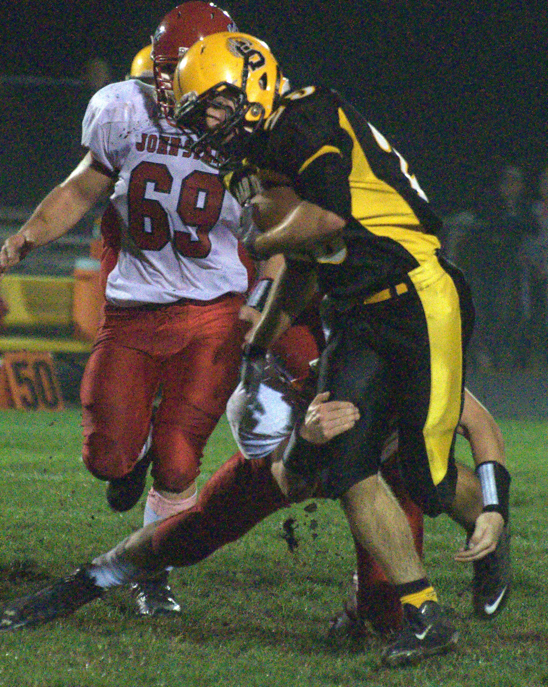 Souhegan's Drew Prescott fights for yards during Friday's game against John Stark.