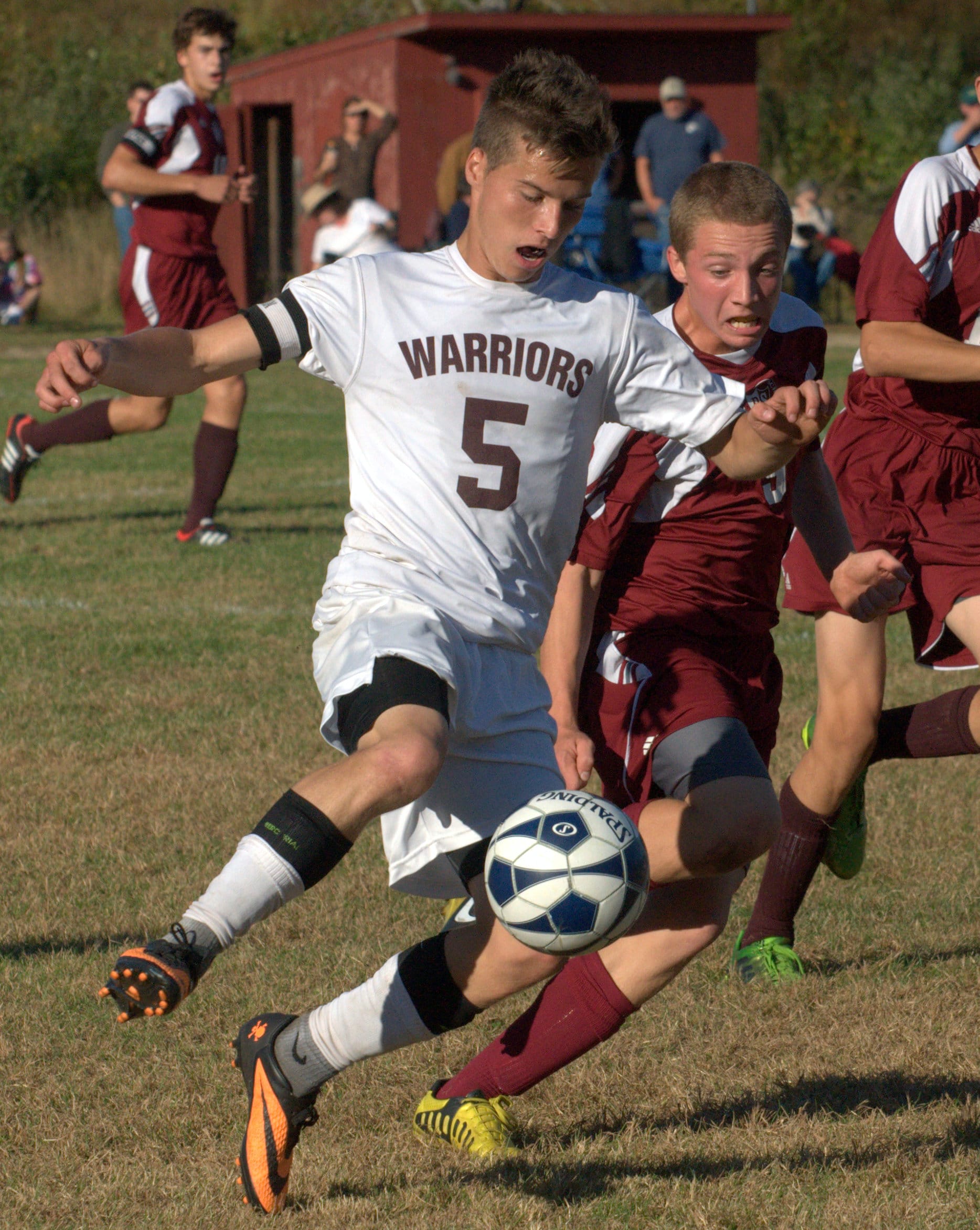 Wilton-Lyndeborough's James Edmunds tries to keep the ball away from Derryfield's Lee Sipes during Monday's game.