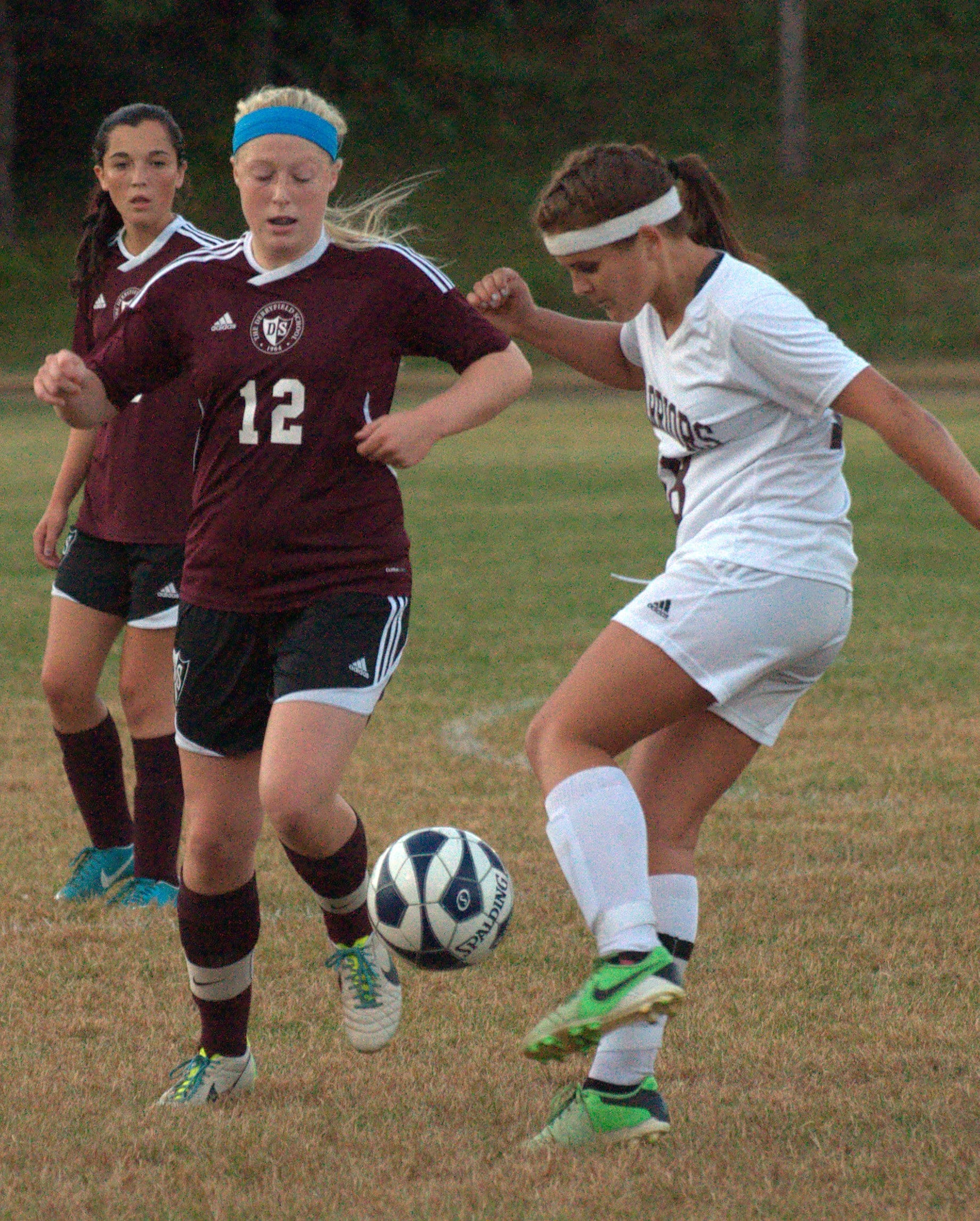 Wilton-Lyndeborough's Kim Edmunds tries to get the ball by Derryfield's Gabi Brummett.