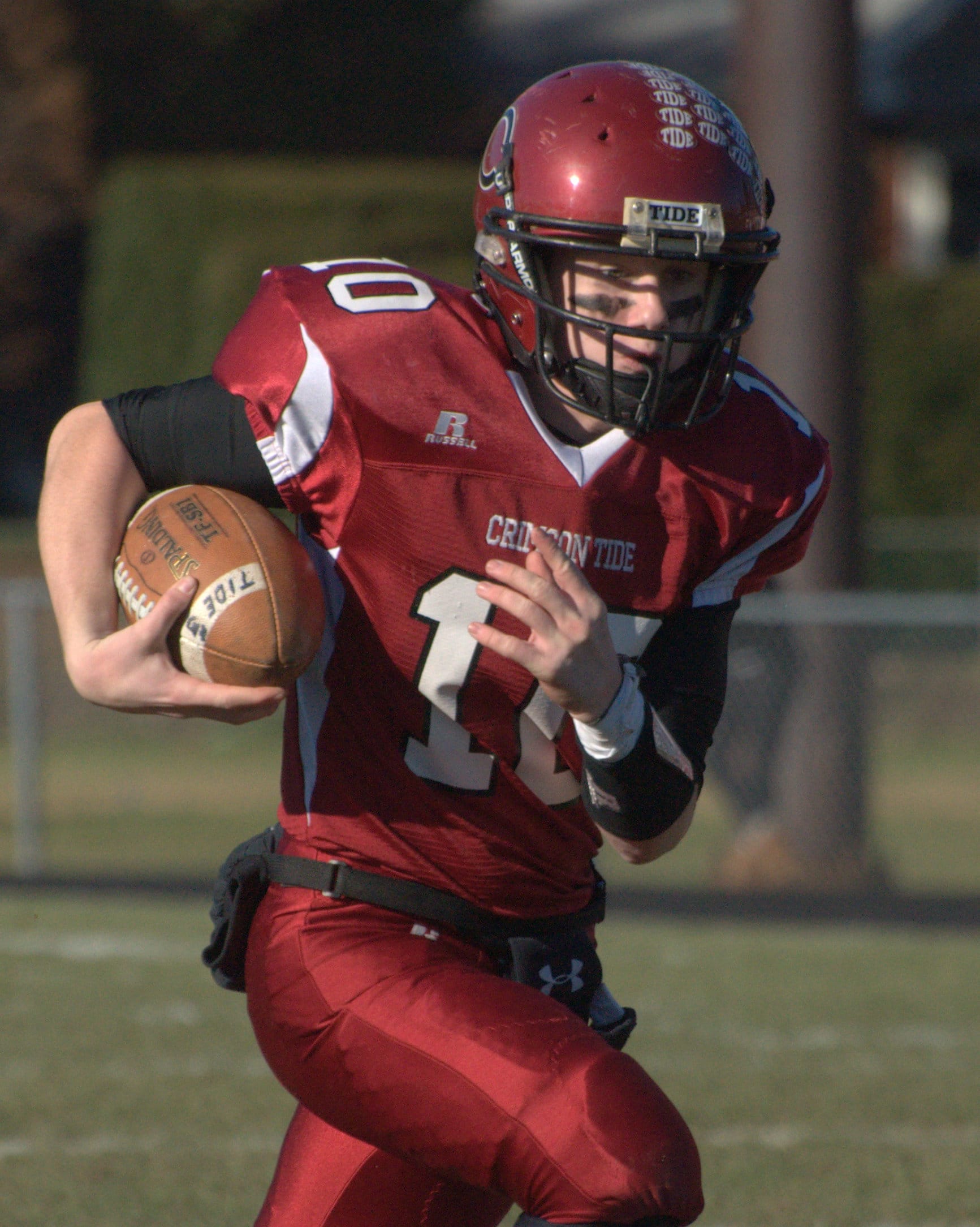 Concord quarterback Robert Law runs for a first down during Saturday's game.